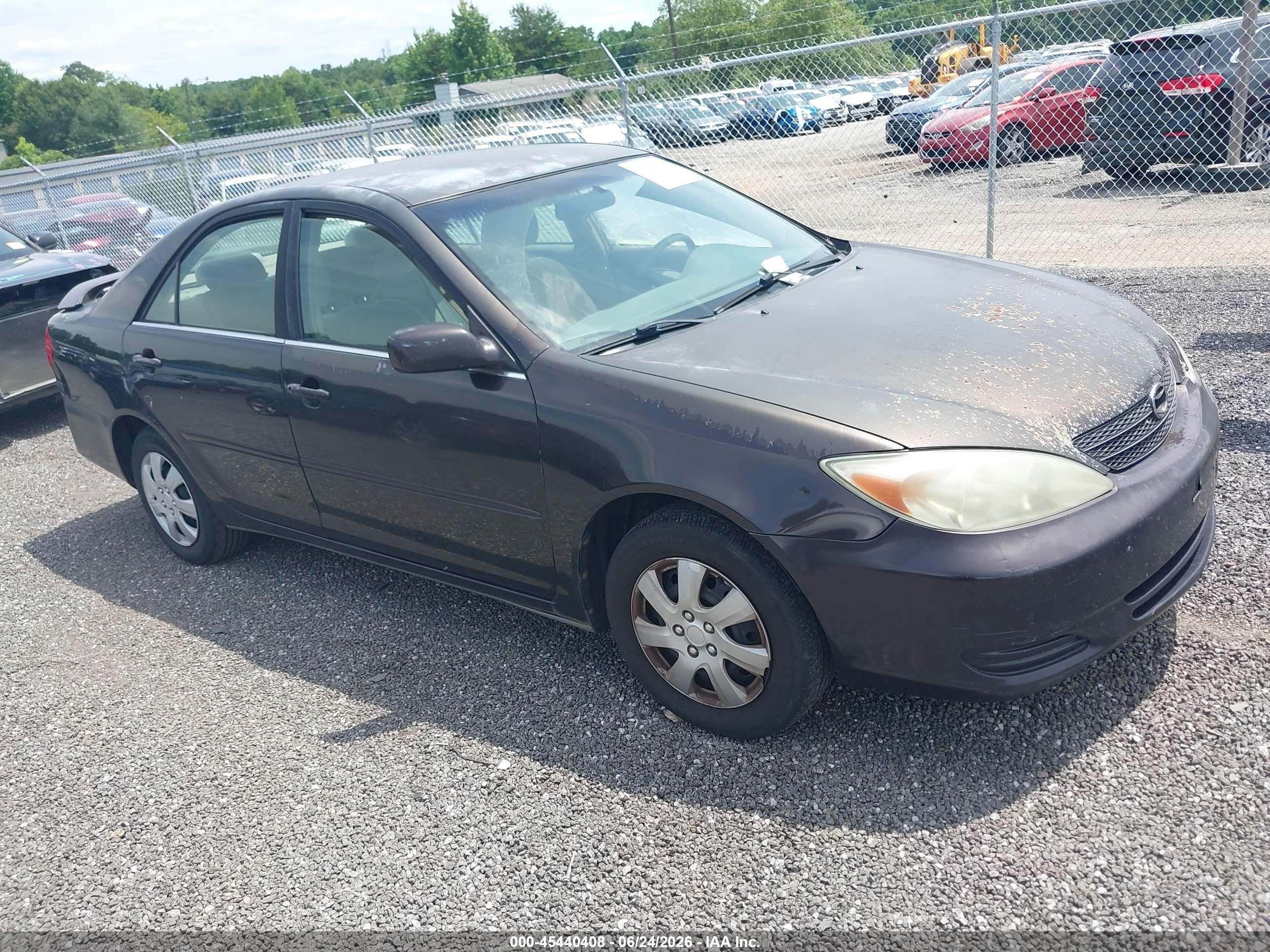 2002 Toyota Camry LE, VIN 4T1BE32K22U569188 — Side
