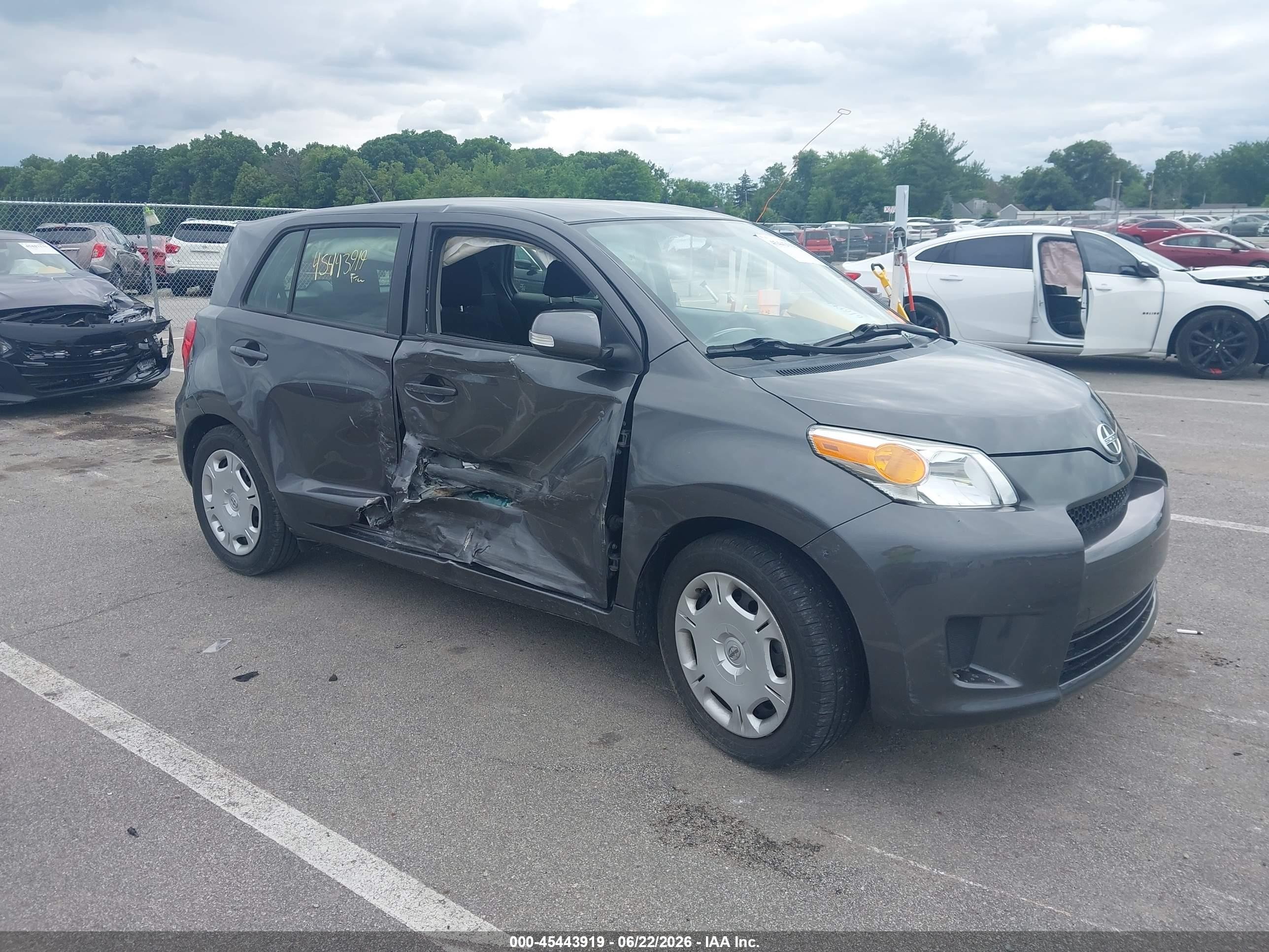 2012 Scion xD, VIN JTKKU4B4XC1018338 — Side