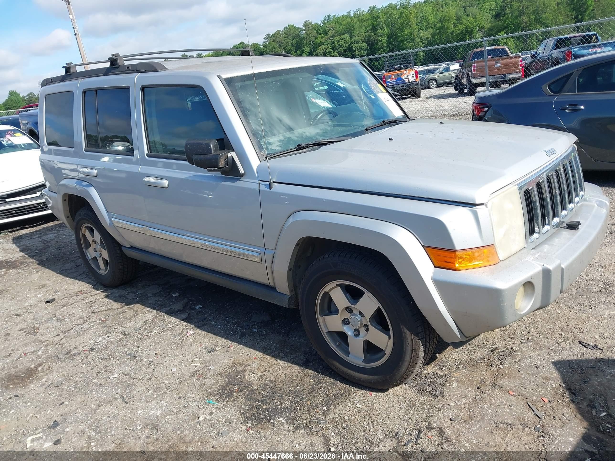 2010 Jeep Commander Sport, VIN 1J4RH4GKXAC145393 — Side
