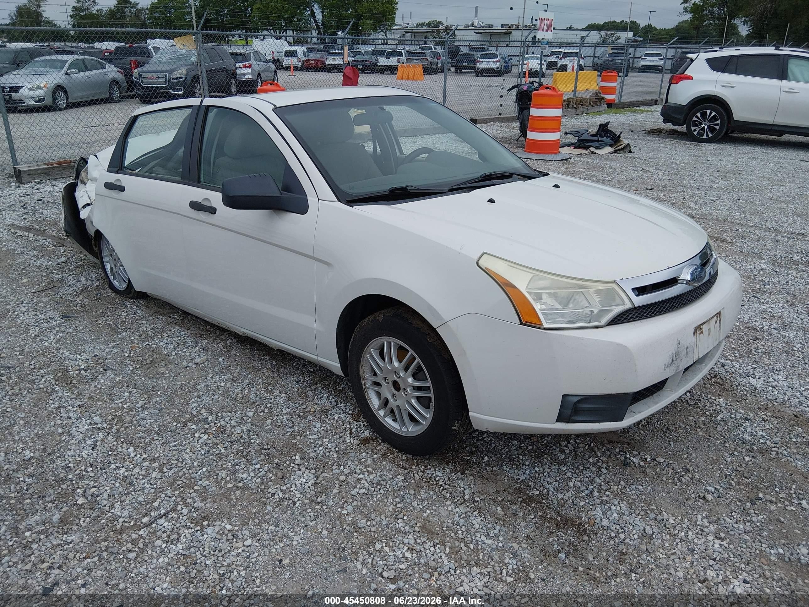 2010 Ford Focus SE, VIN 1FAHP3FN1AW211649 — Storm