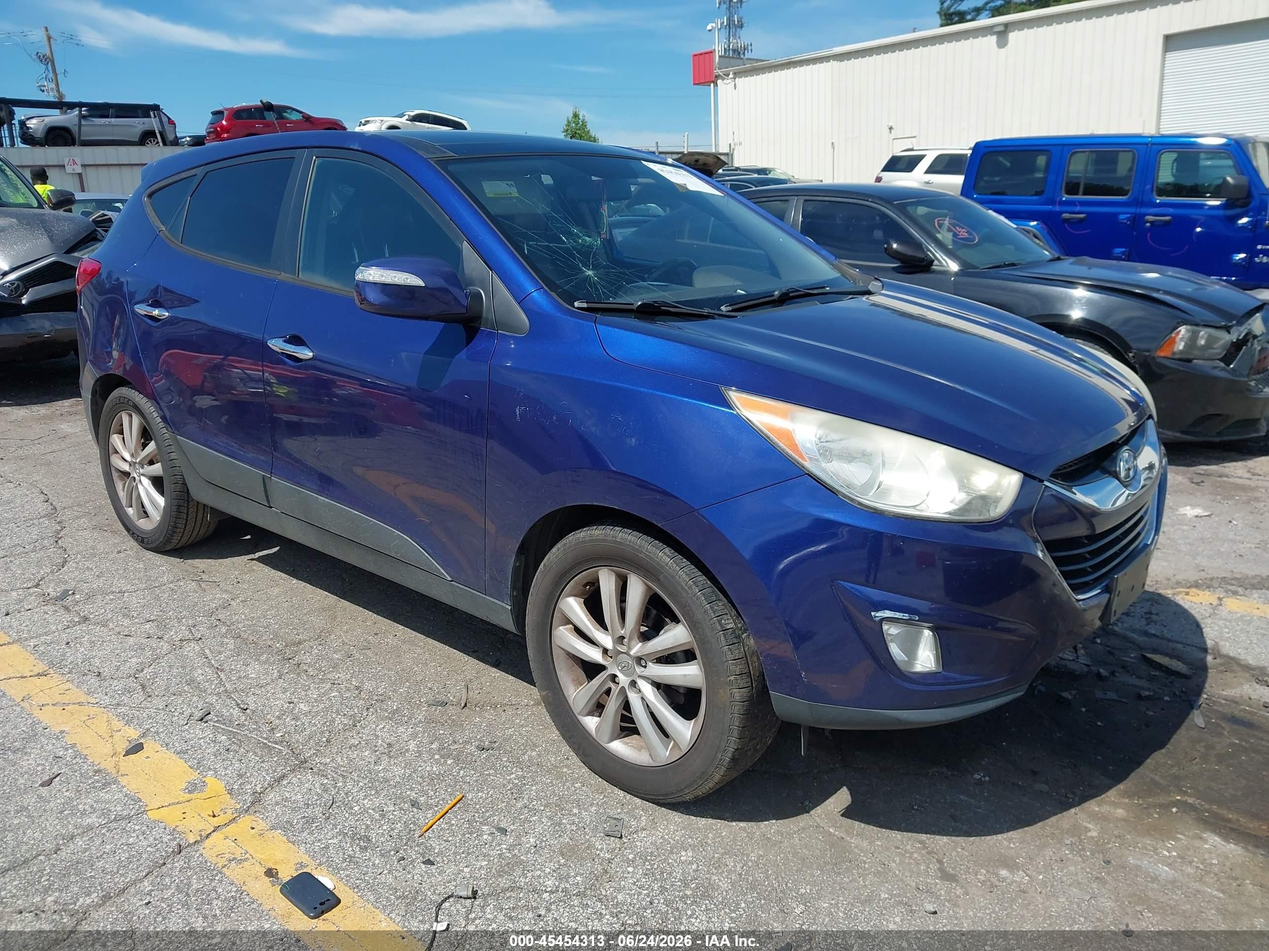2010 Hyundai Tucson Limited, VIN KM8JU3AC1AU036417 — Side