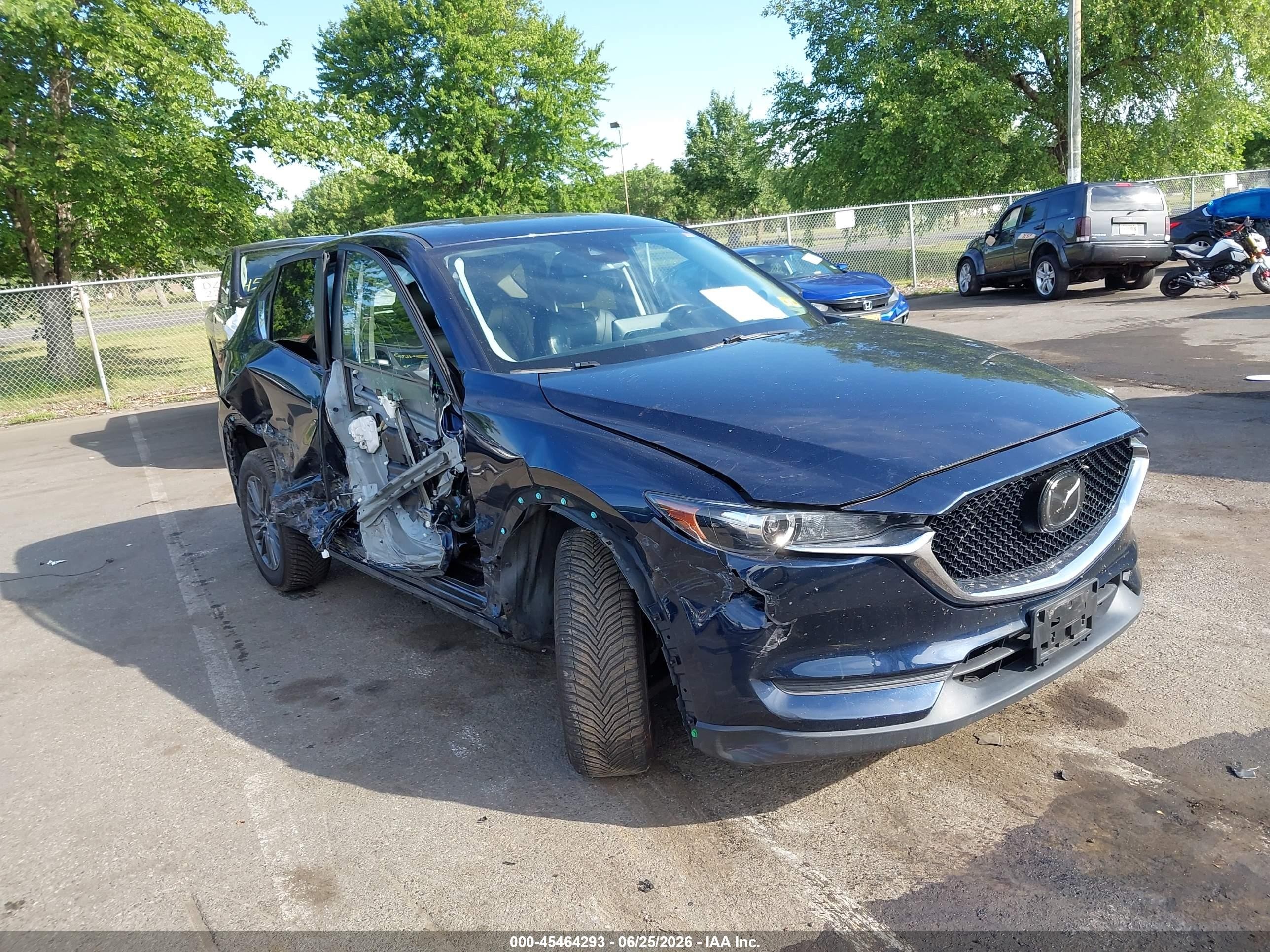 2021 Mazda CX-5 Touring, VIN JM3KFBCM0M1335705 — Side