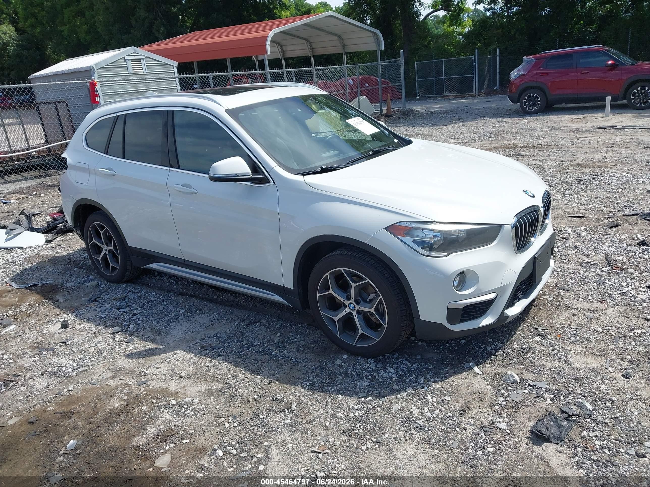 2018 BMW X1 sDrive28i, VIN WBXHU7C36J5L07685 — Rear end
