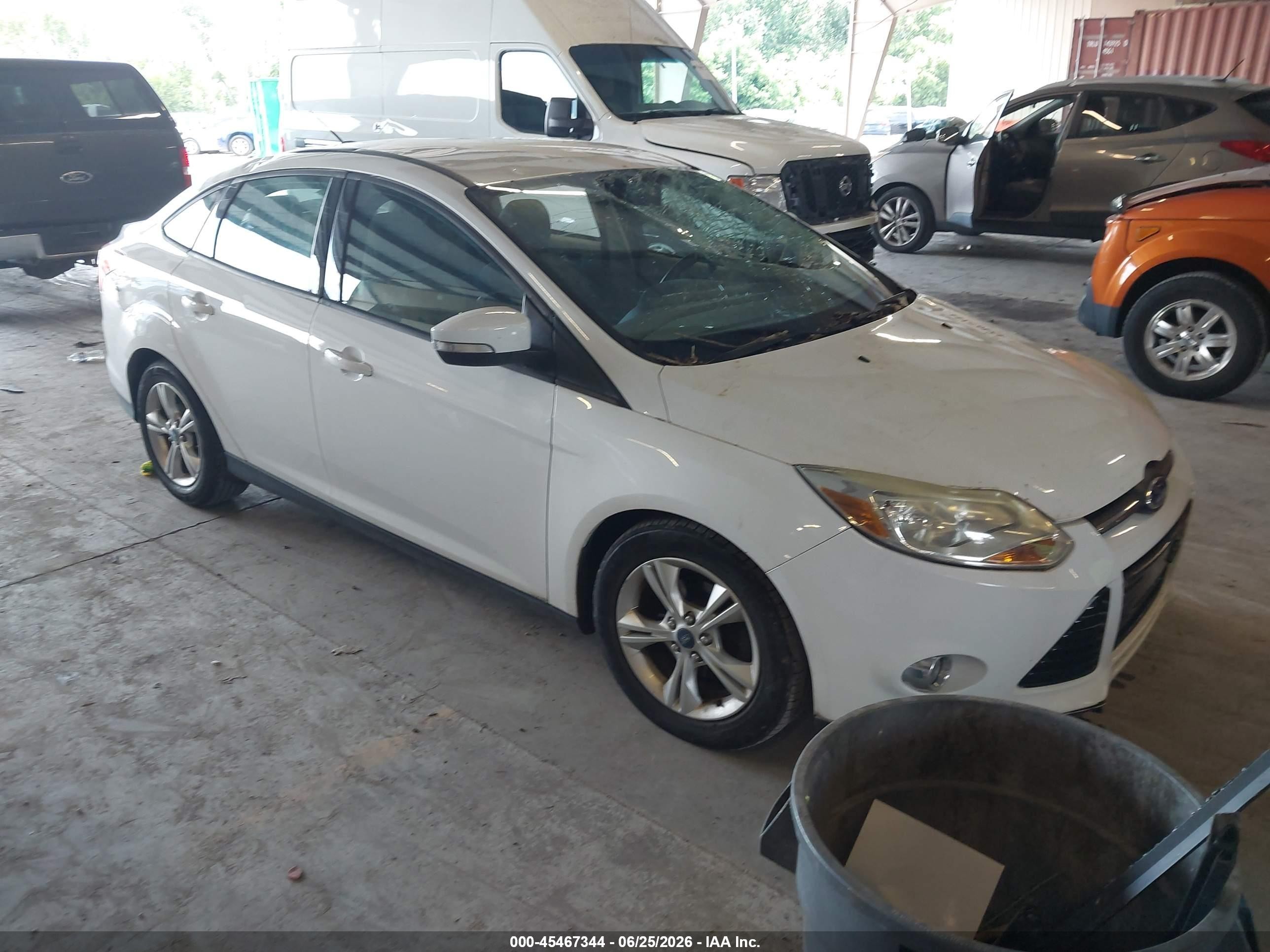 2013 Ford Focus SE, VIN 1FADP3F22DL216840 — Storm