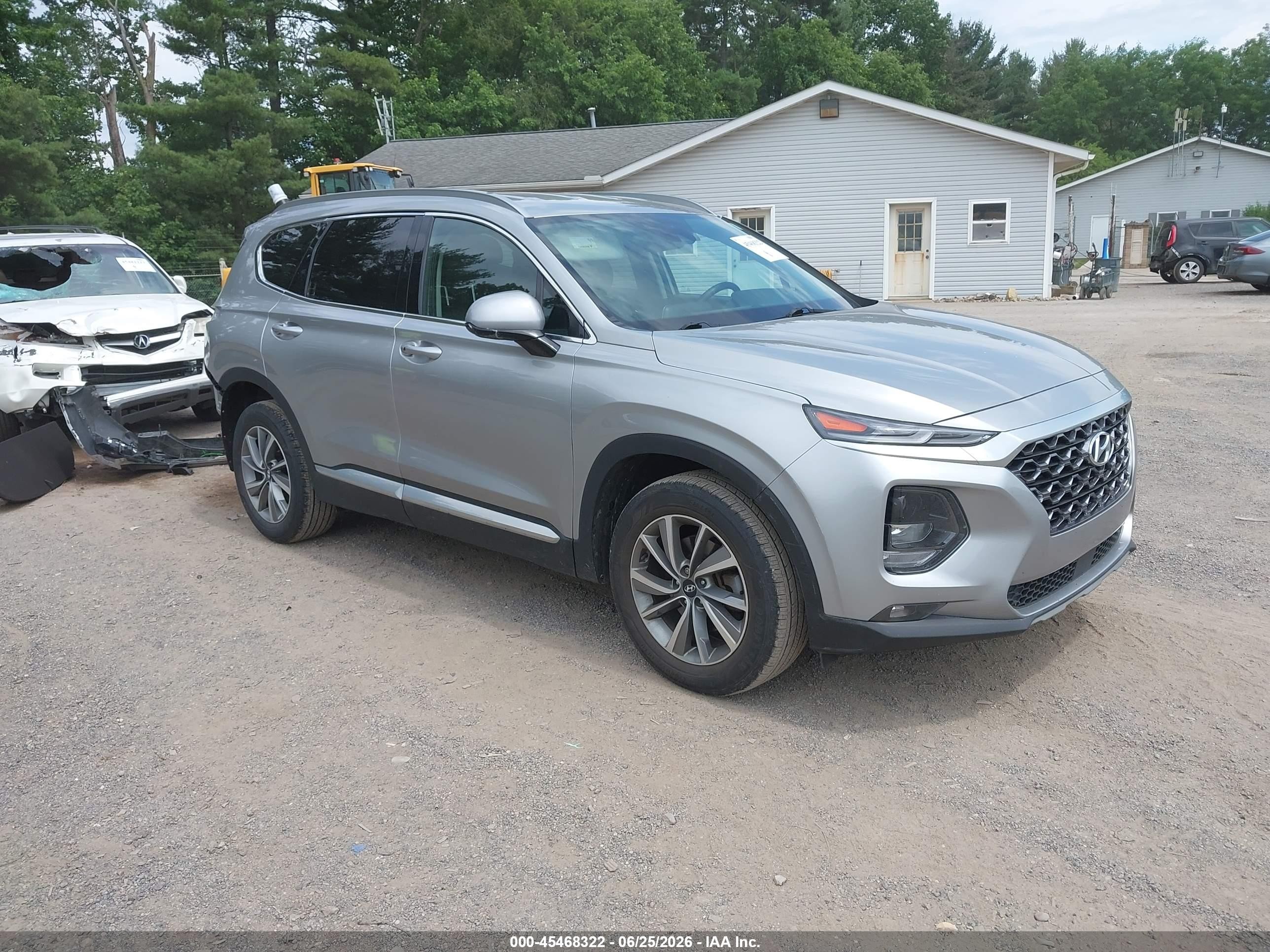 2020 Hyundai Santa Fe SEL, VIN 5NMS3CAD7LH208593 — Rear end