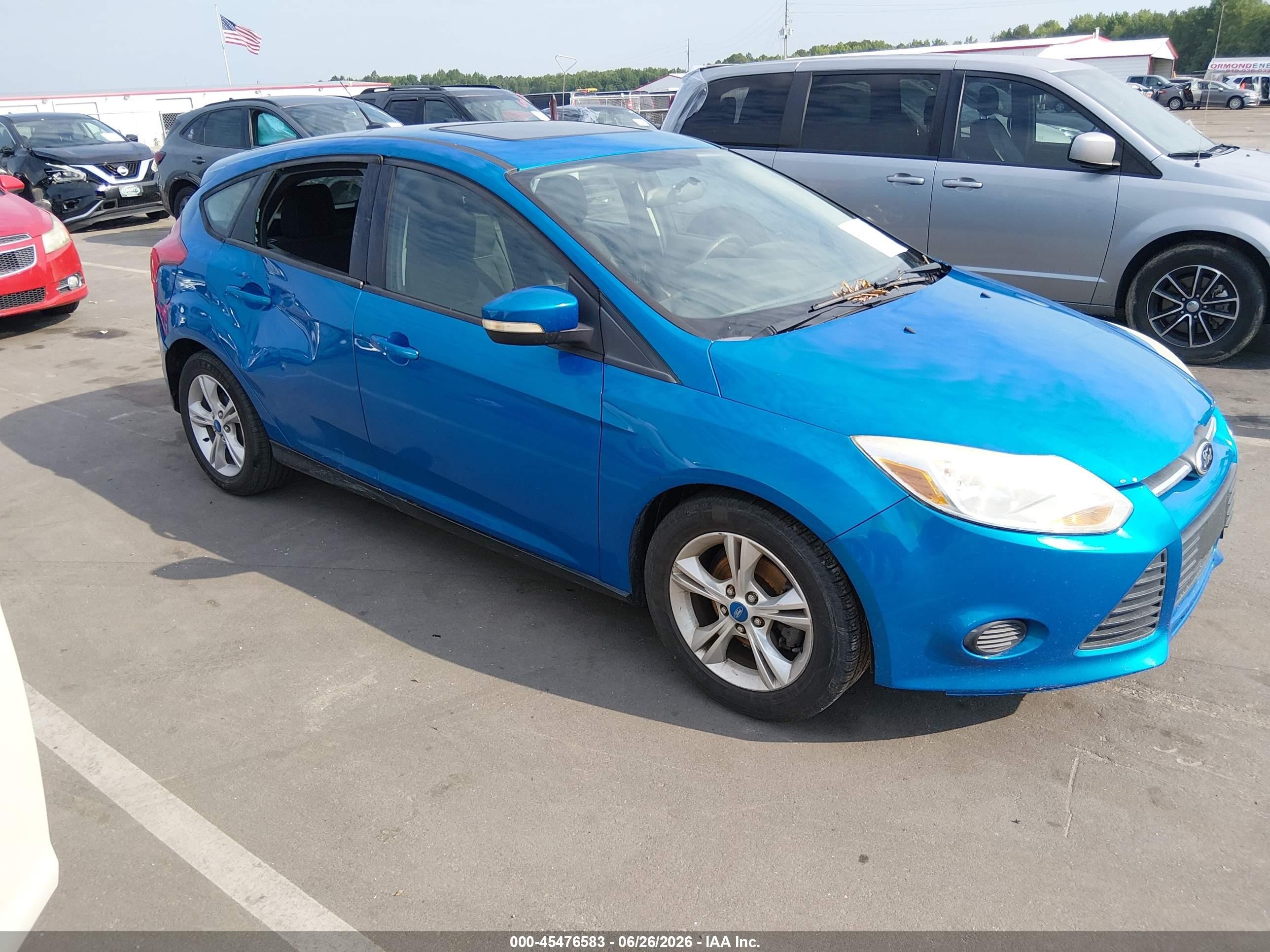 2013 Ford Focus SE, VIN 1FADP3K26DL168054 — Storm