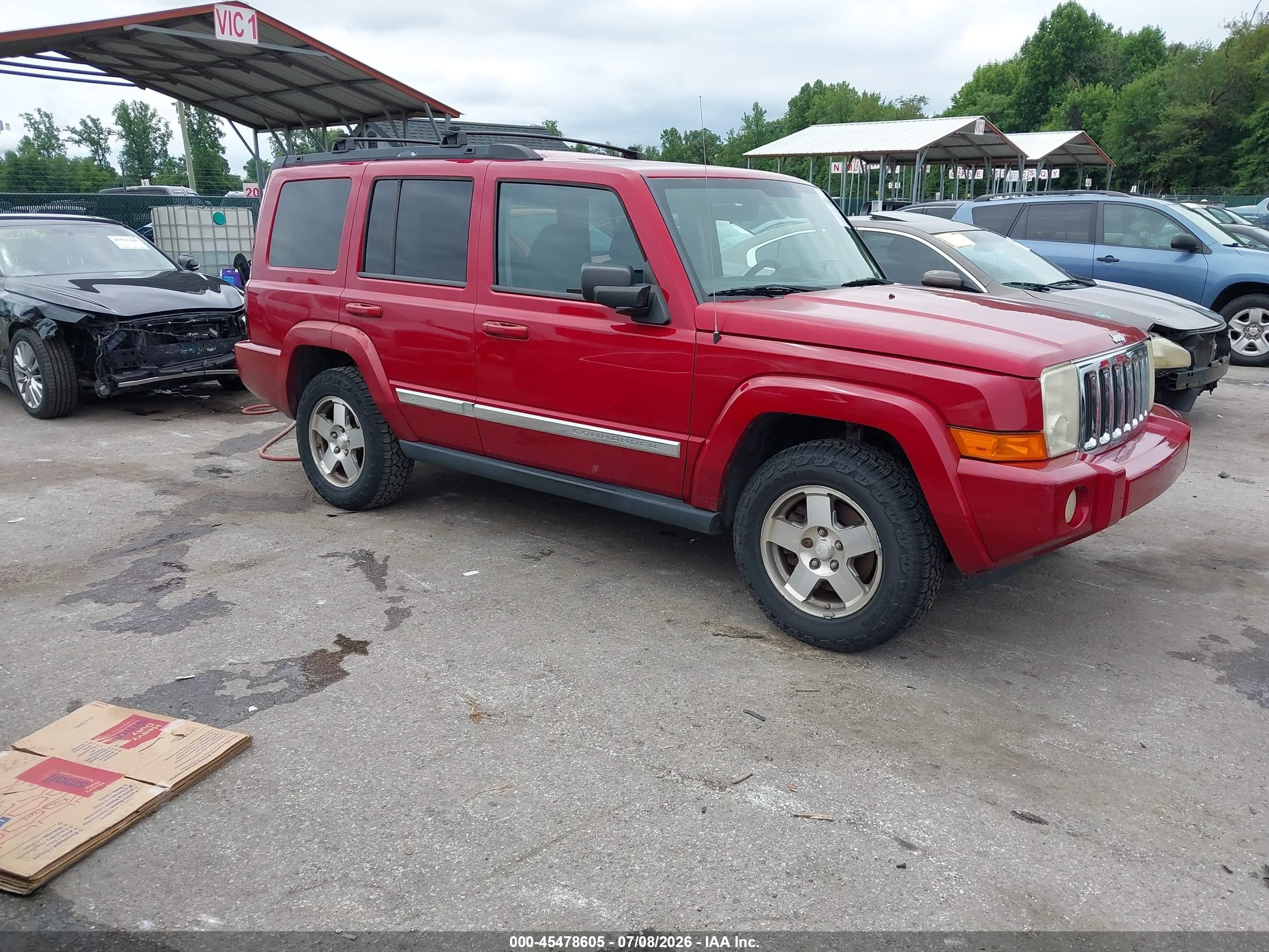 2010 Jeep Commander Sport, VIN 1J4RH4GK7AC106969 — Side