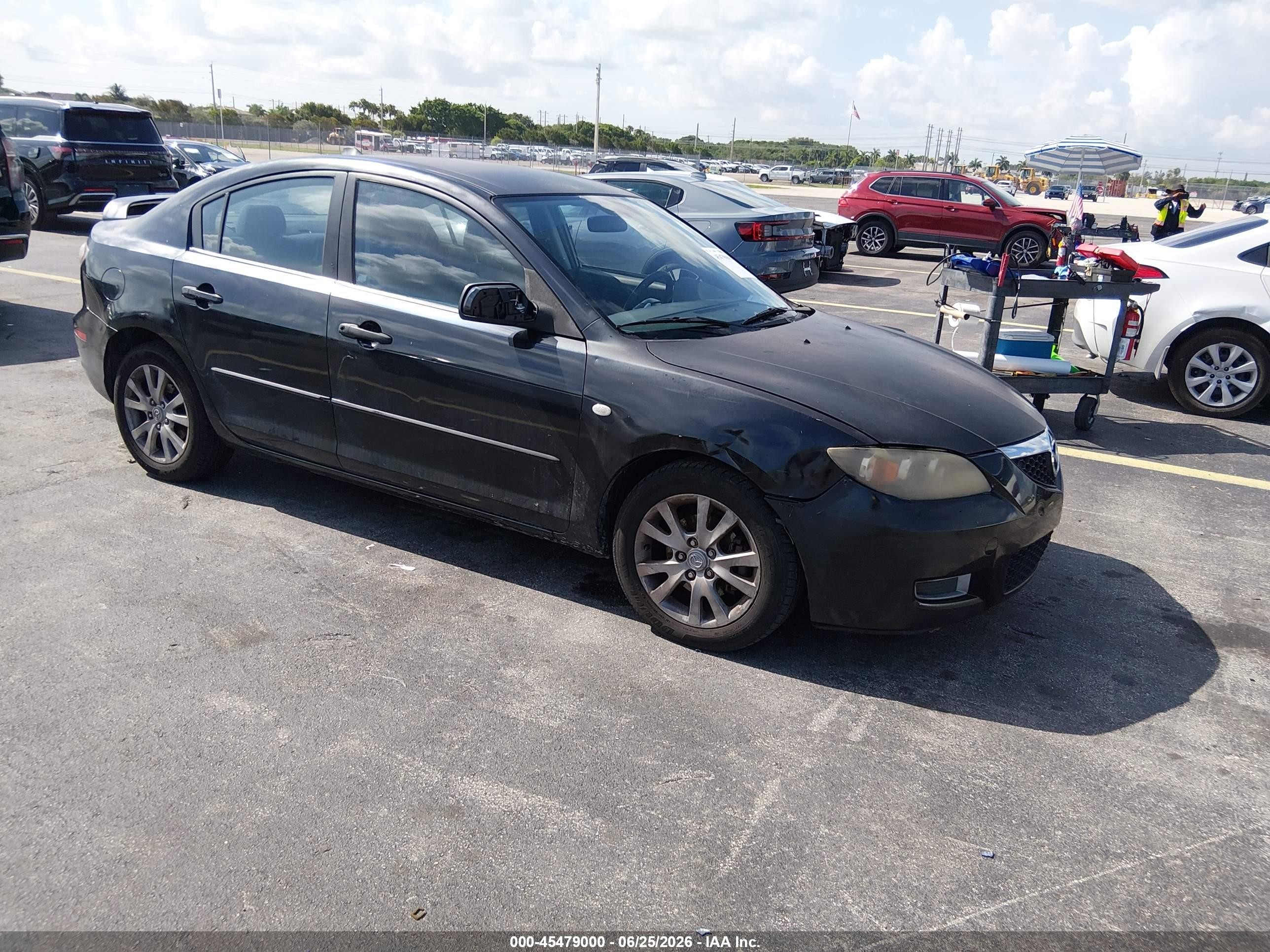 2007 Mazda 3 i Touring, VIN JM1BK12F771734813 — Side