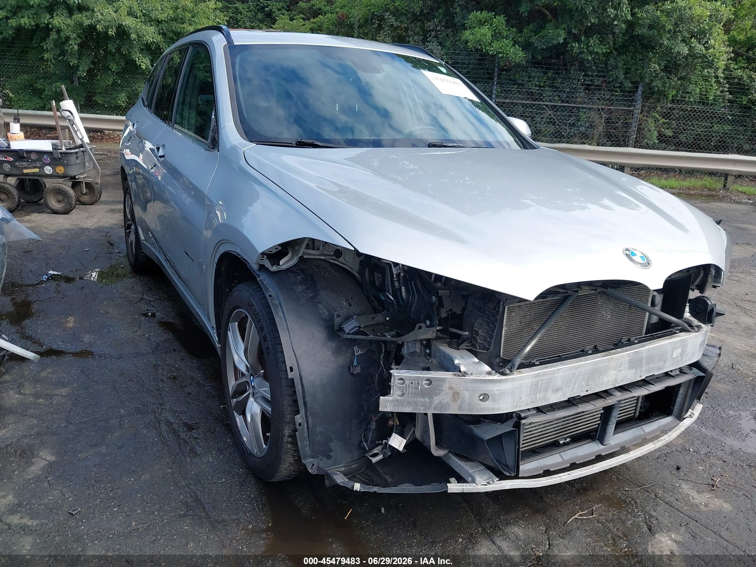 2018 BMW X1 xDrive28i, VIN WBXHT3C33J5L26528 — Side