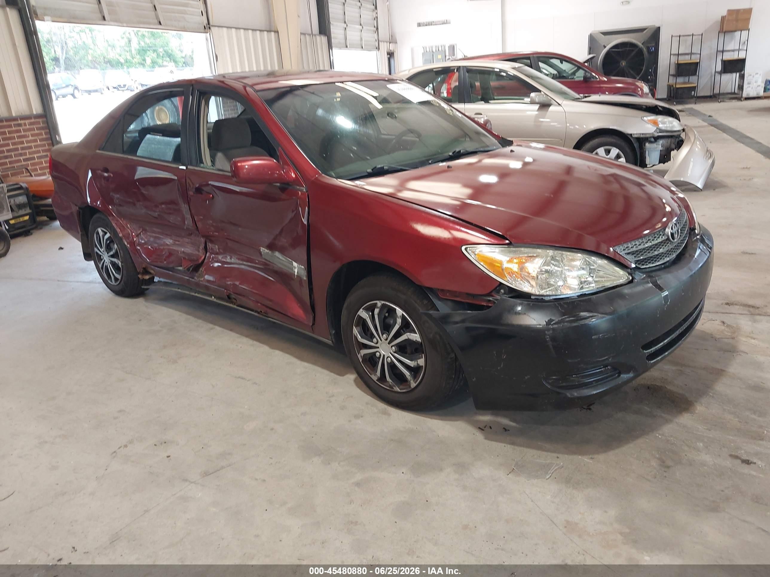2002 Toyota Camry LE, VIN 4T1BE32K02U067893 — Side