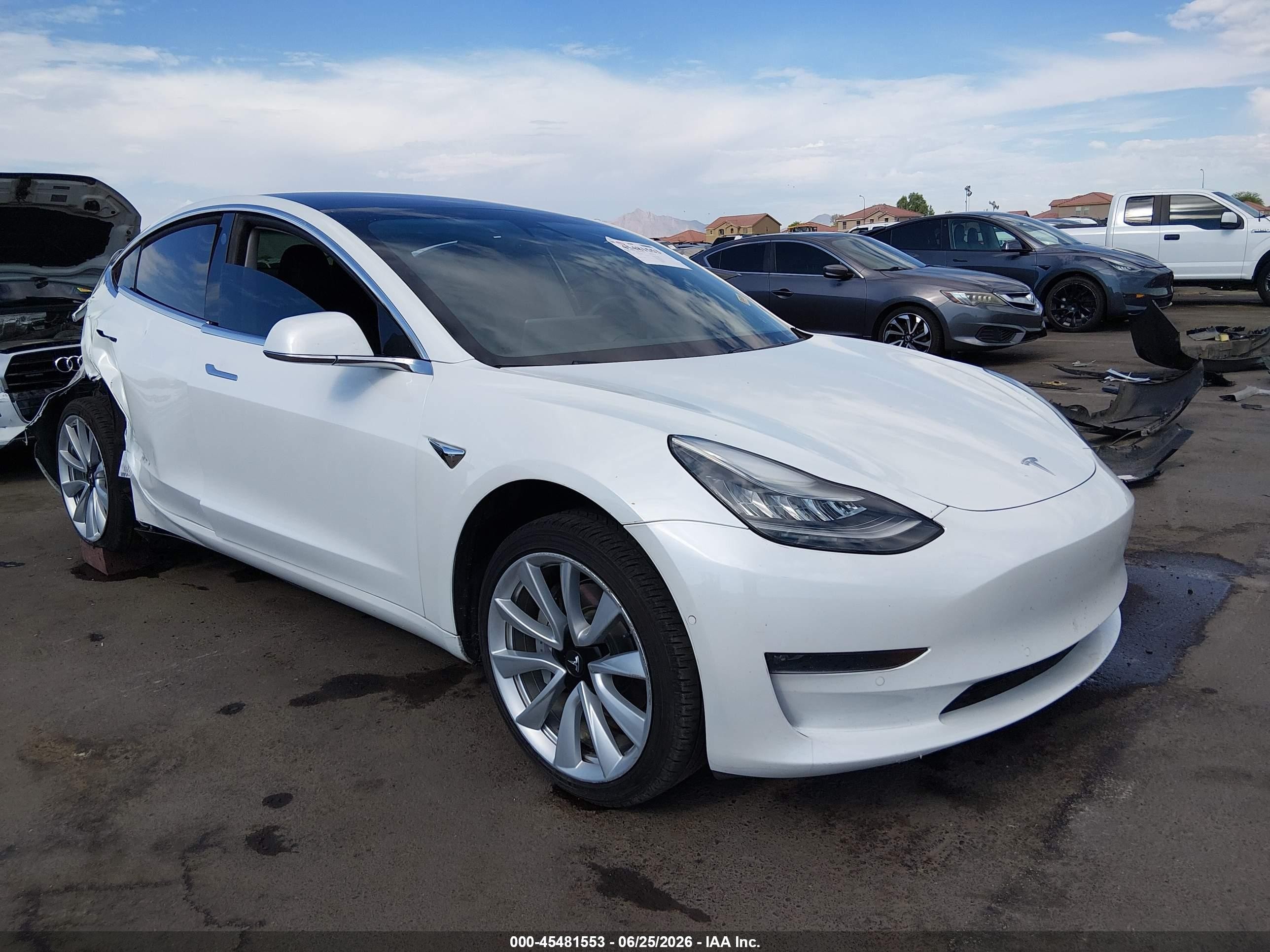 2019 Tesla Model 3 Mid Range, VIN 5YJ3E1EA2KF301489 — Rear end