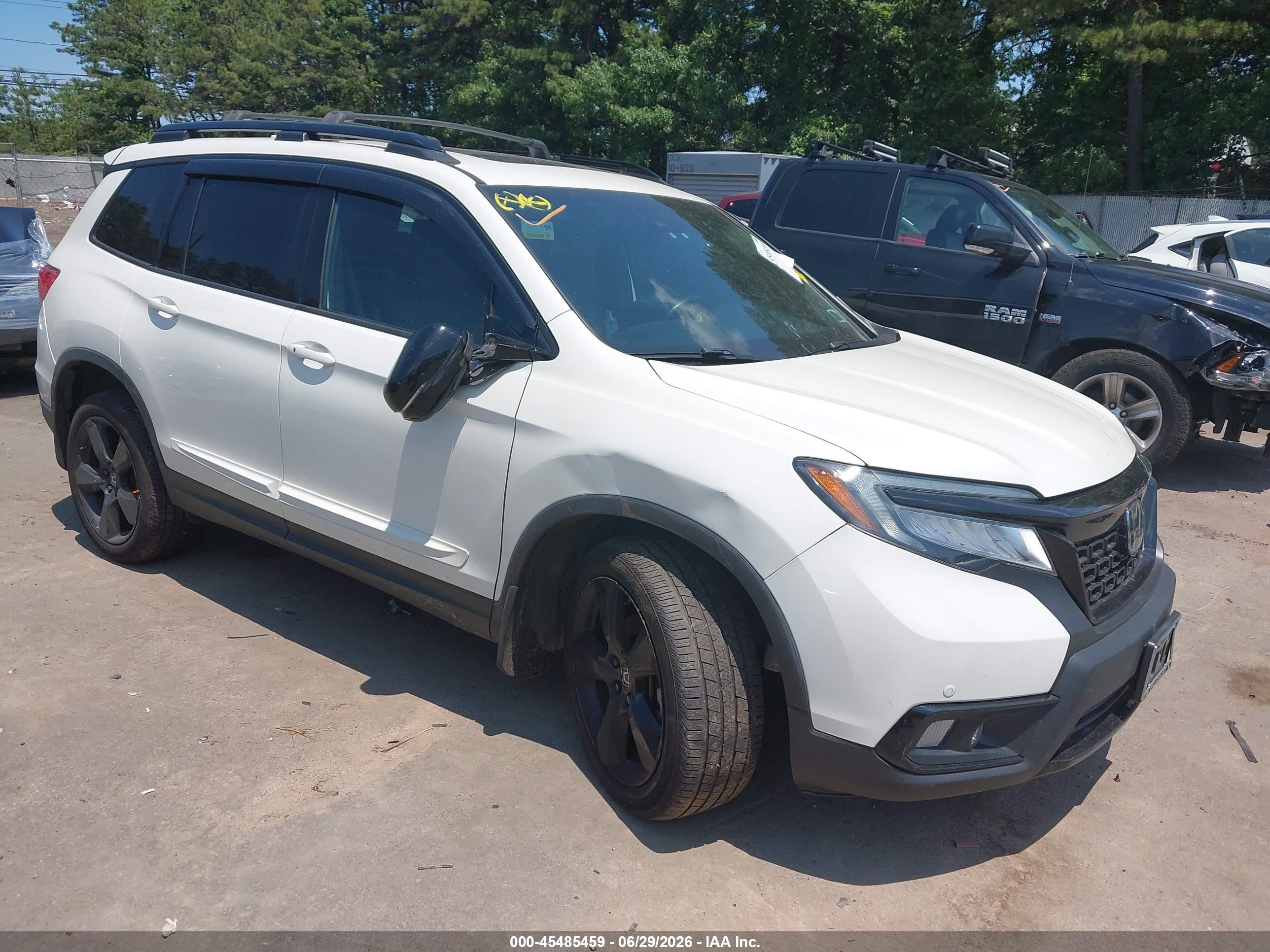 2019 Honda Passport Elite, VIN 5FNYF8H04KB003511 — Side