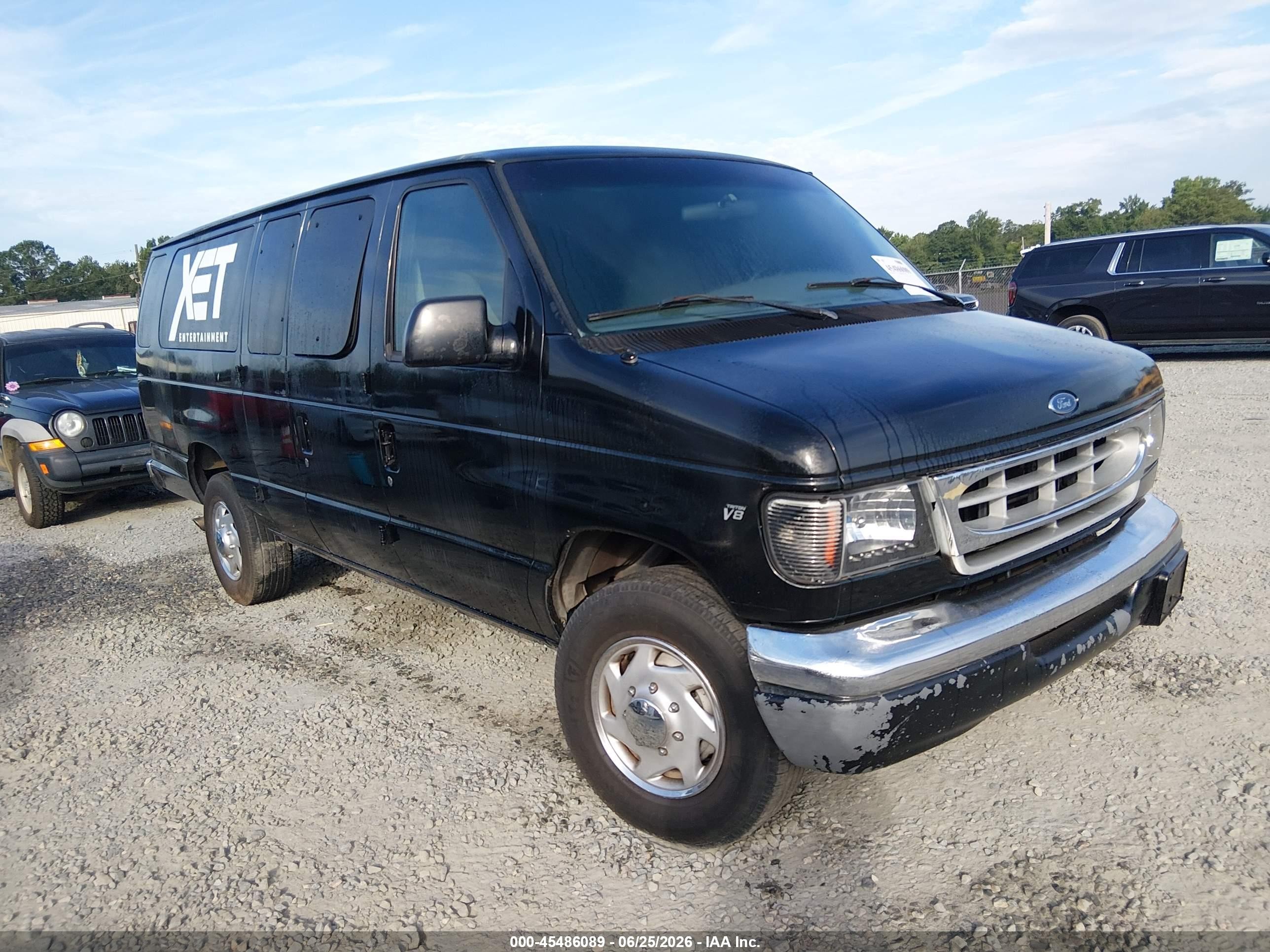 1998 Ford Econoline Wagon XL, VIN 1FBSS31L3WHA23591 — Normal wear