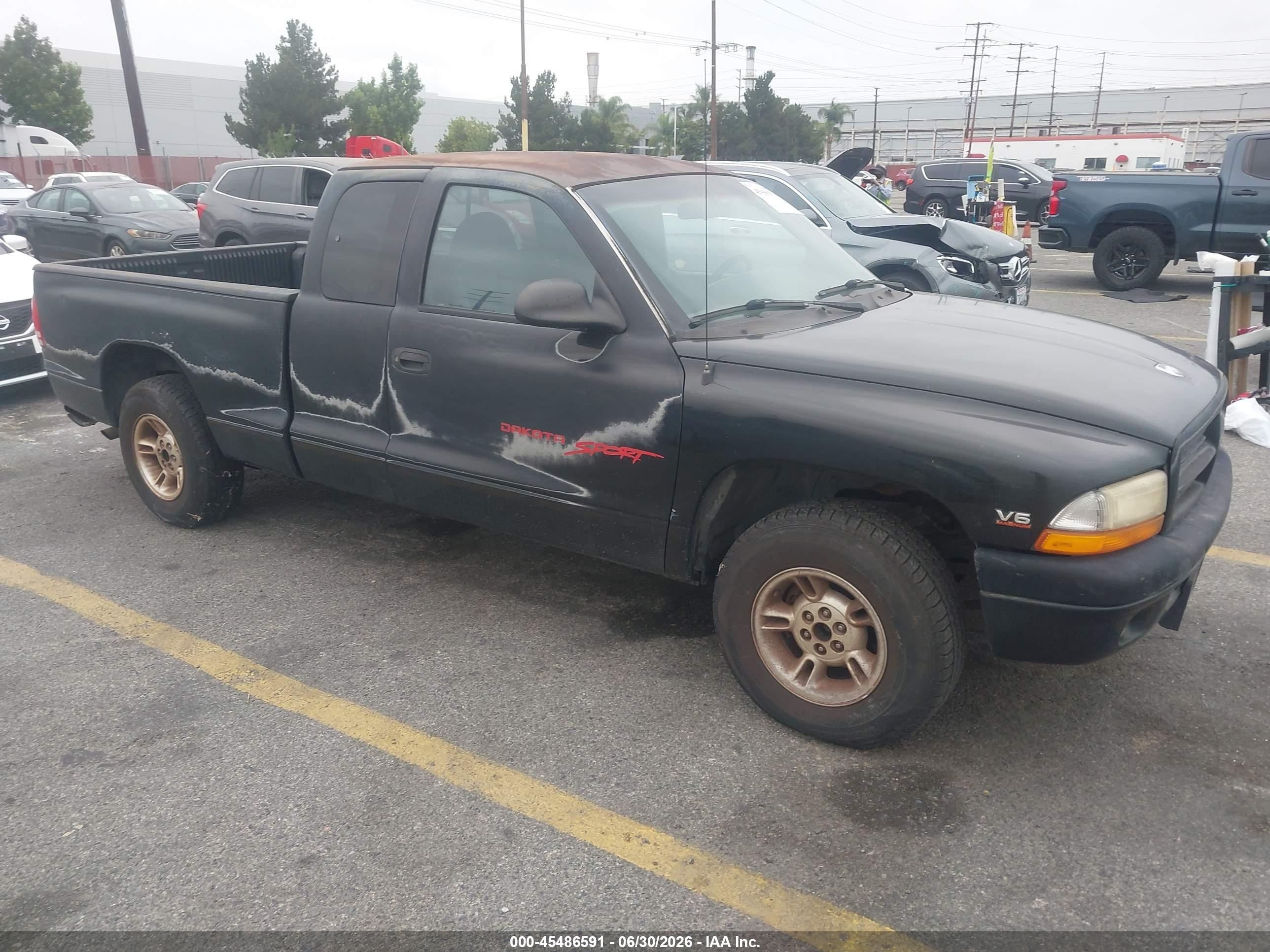 1999 Dodge Dakota SLT, VIN 1B7GL22X1XS303136 — Зад