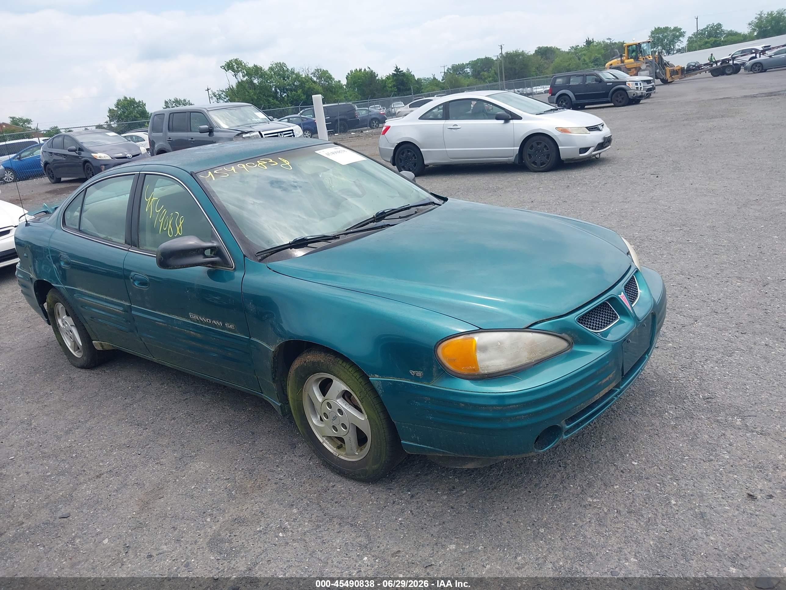 1999 Pontiac Grand Am SE1, VIN 1G2NE52E1XM888990 — Normal wear