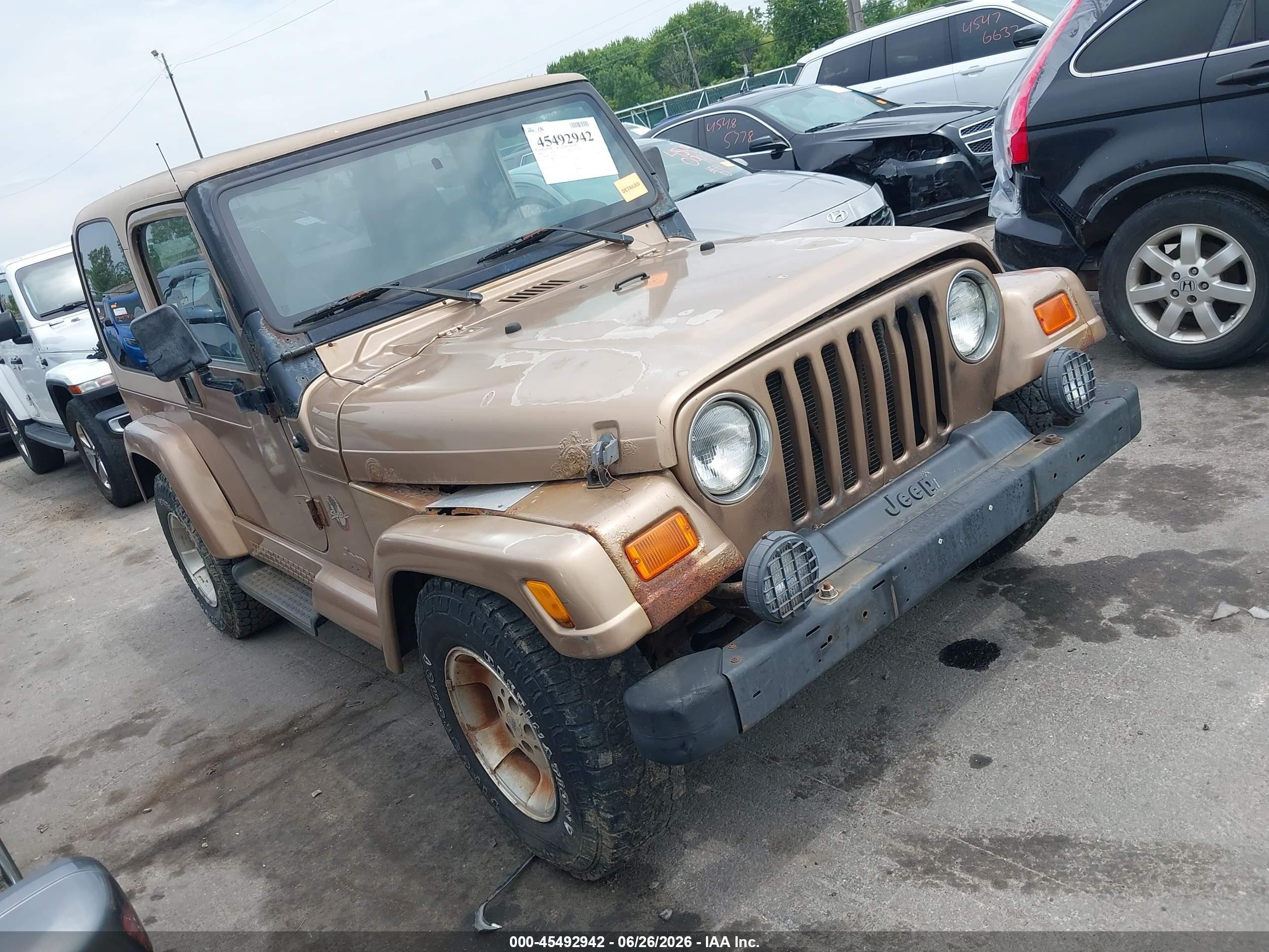 2000 Jeep Wrangler Sahara, VIN 1J4FA59S4YP754511 — Normal wear