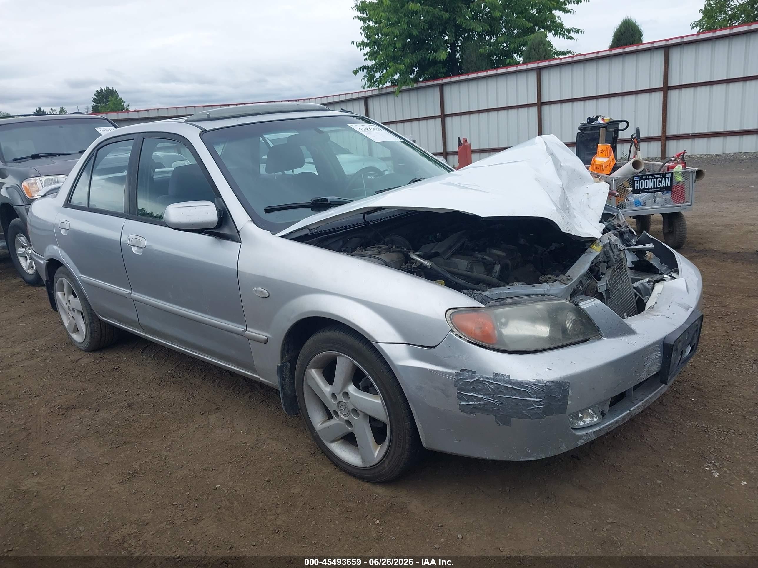 2002 Mazda Protege DX, VIN JM1BJ226320638927 — All over