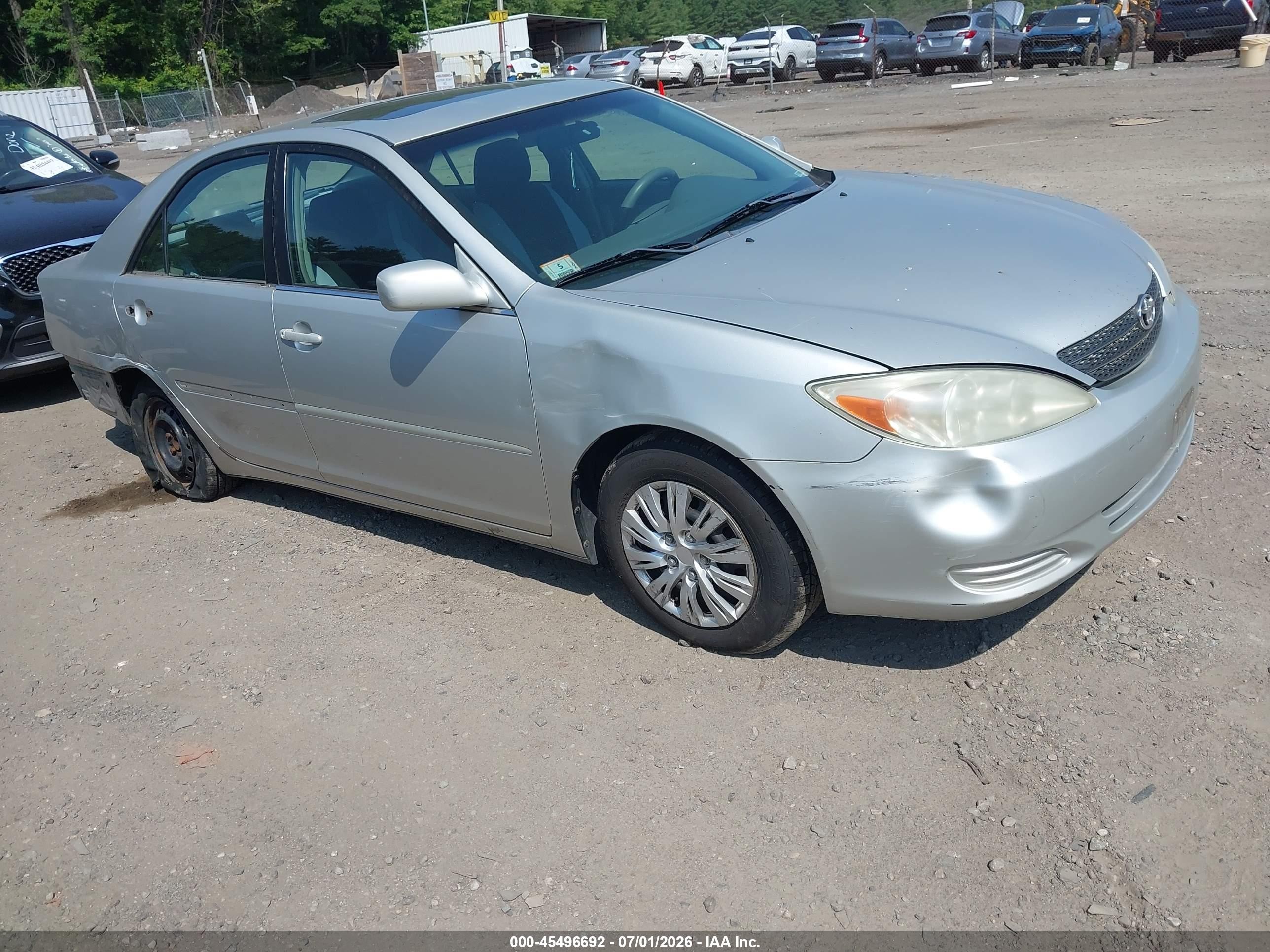 2002 Toyota Camry LE, VIN 4T1BE32K92U114113 — Side