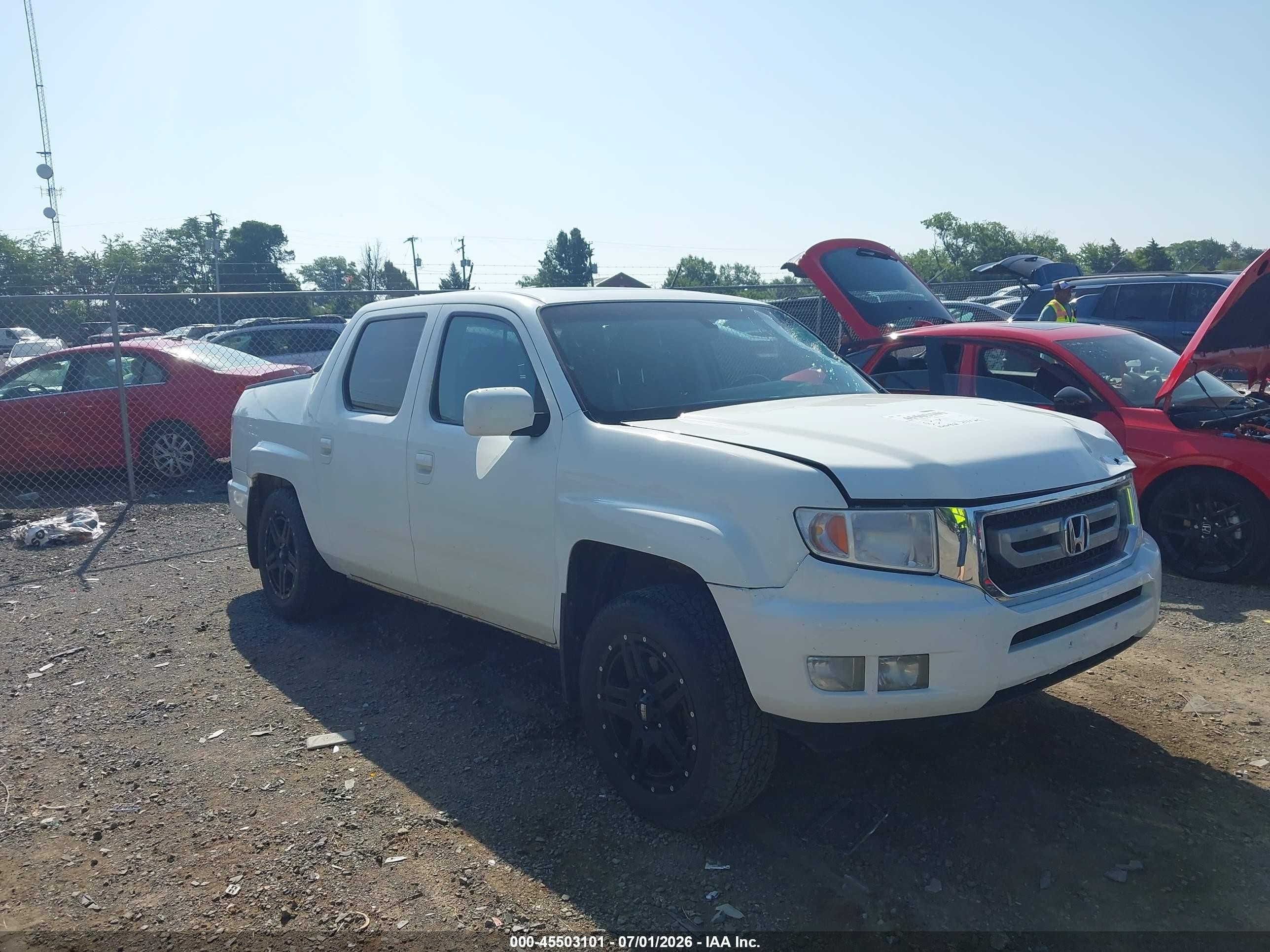 2011 Honda Ridgeline RTL, VIN 5FPYK1F59BB007563 — Side