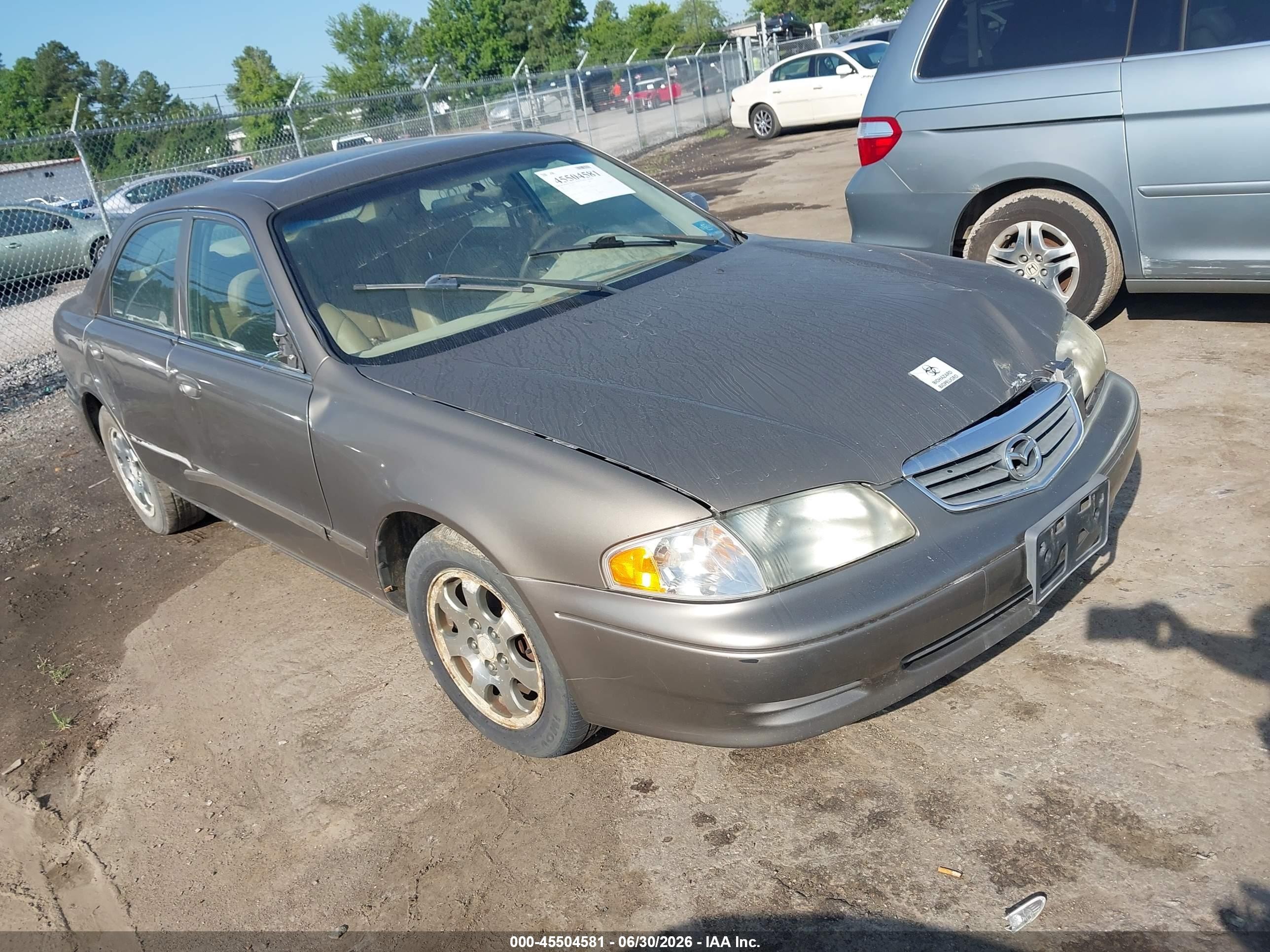 2001 Mazda 626 LX, VIN 1YVGF22C715243187 — По всему кузову