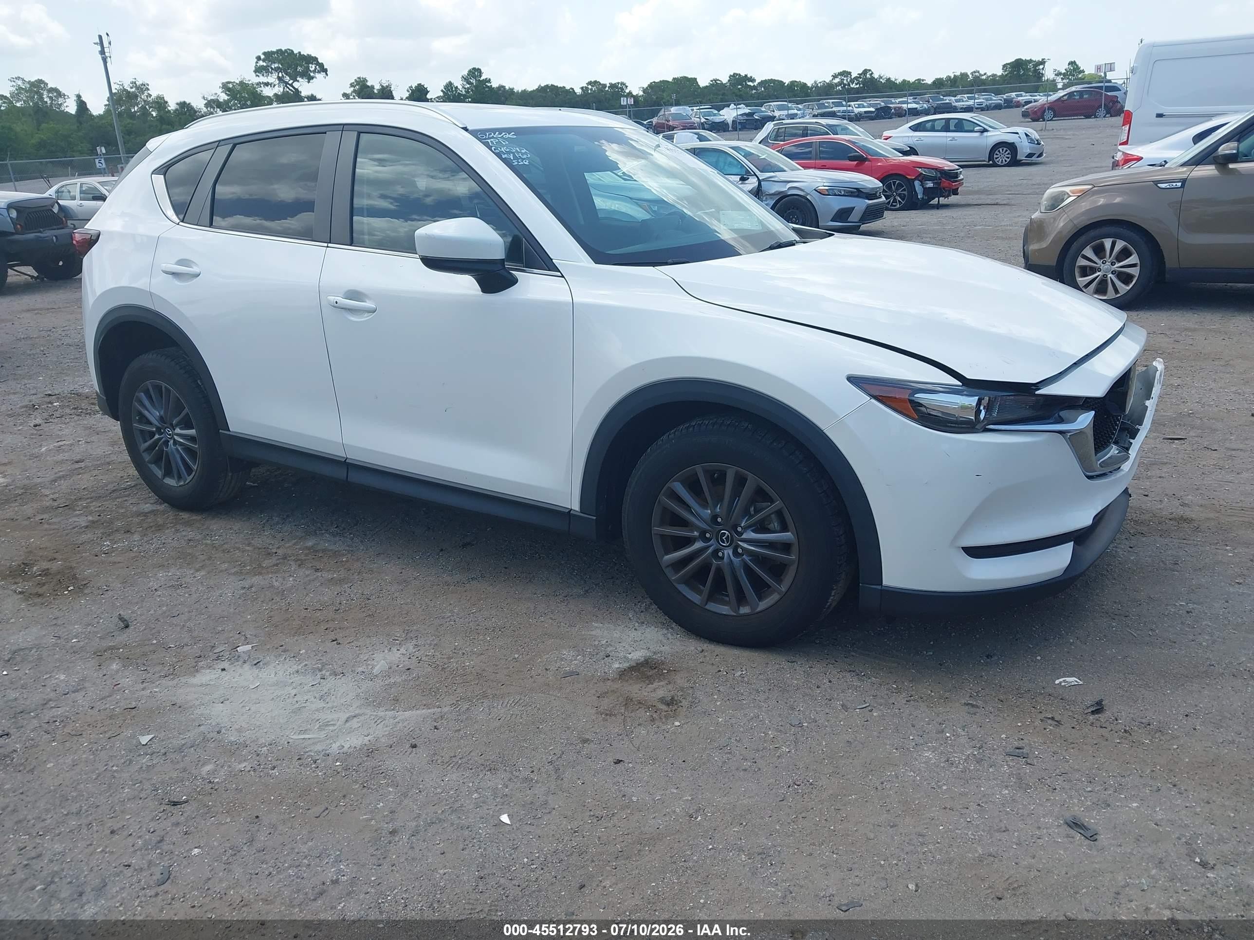 2021 Mazda CX-5 Touring, VIN JM3KFBCM0M1430197 — Front end