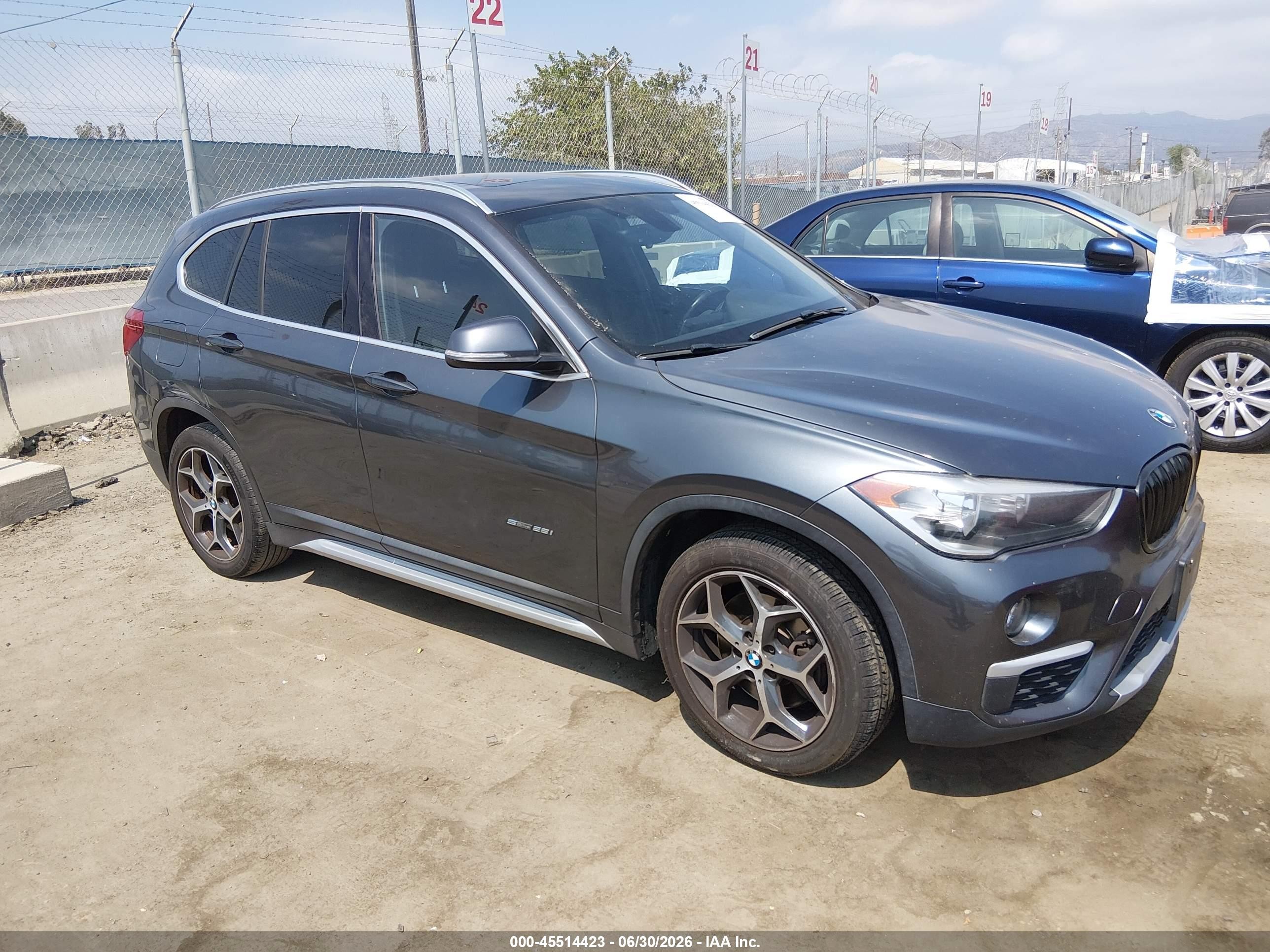 2018 BMW X1 sDrive28i, VIN WBXHU7C3XJ5H42650 — Front end