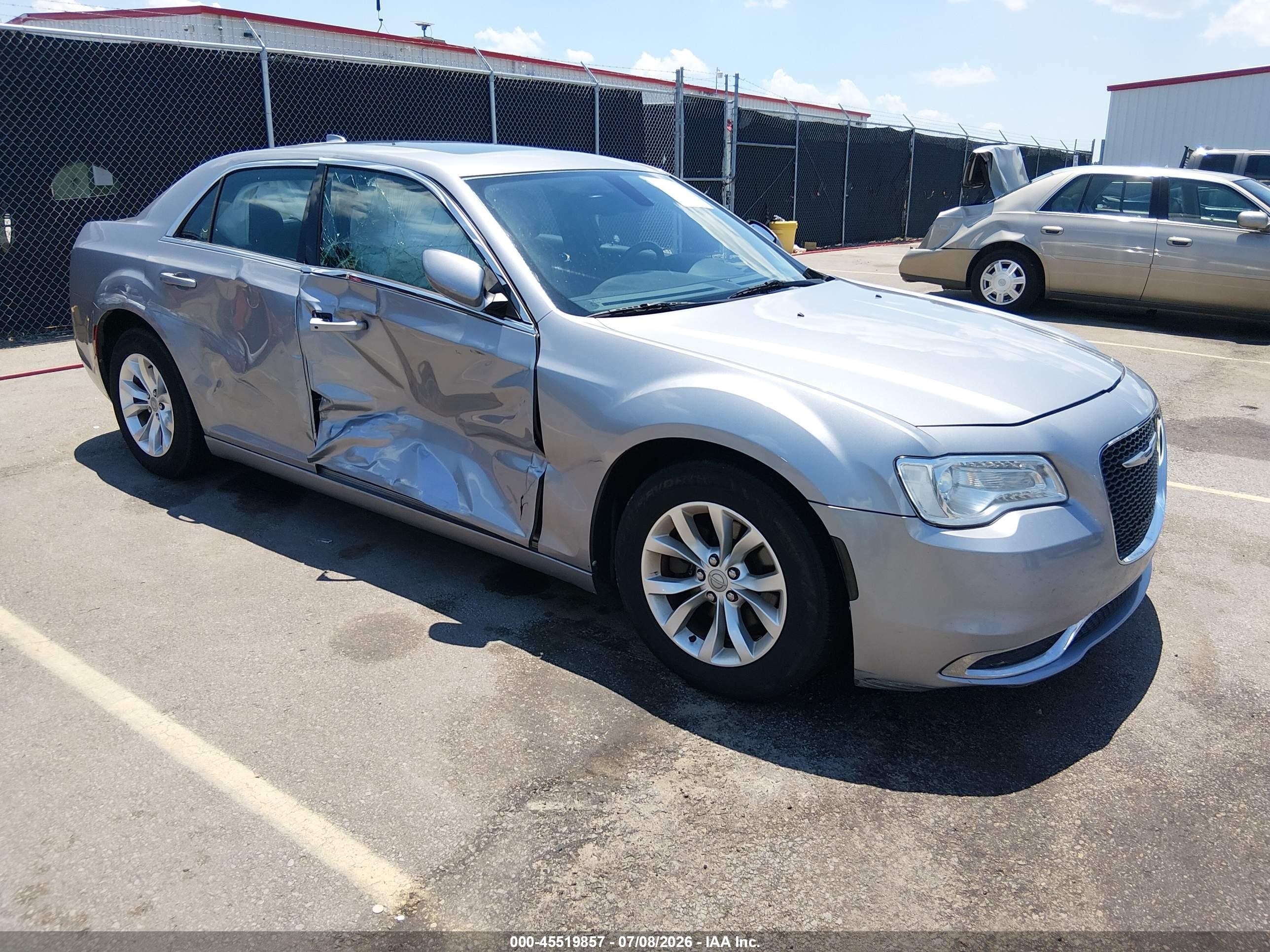 2015 Chrysler 300 Limited, VIN 2C3CCAAG5FH930491 — Side