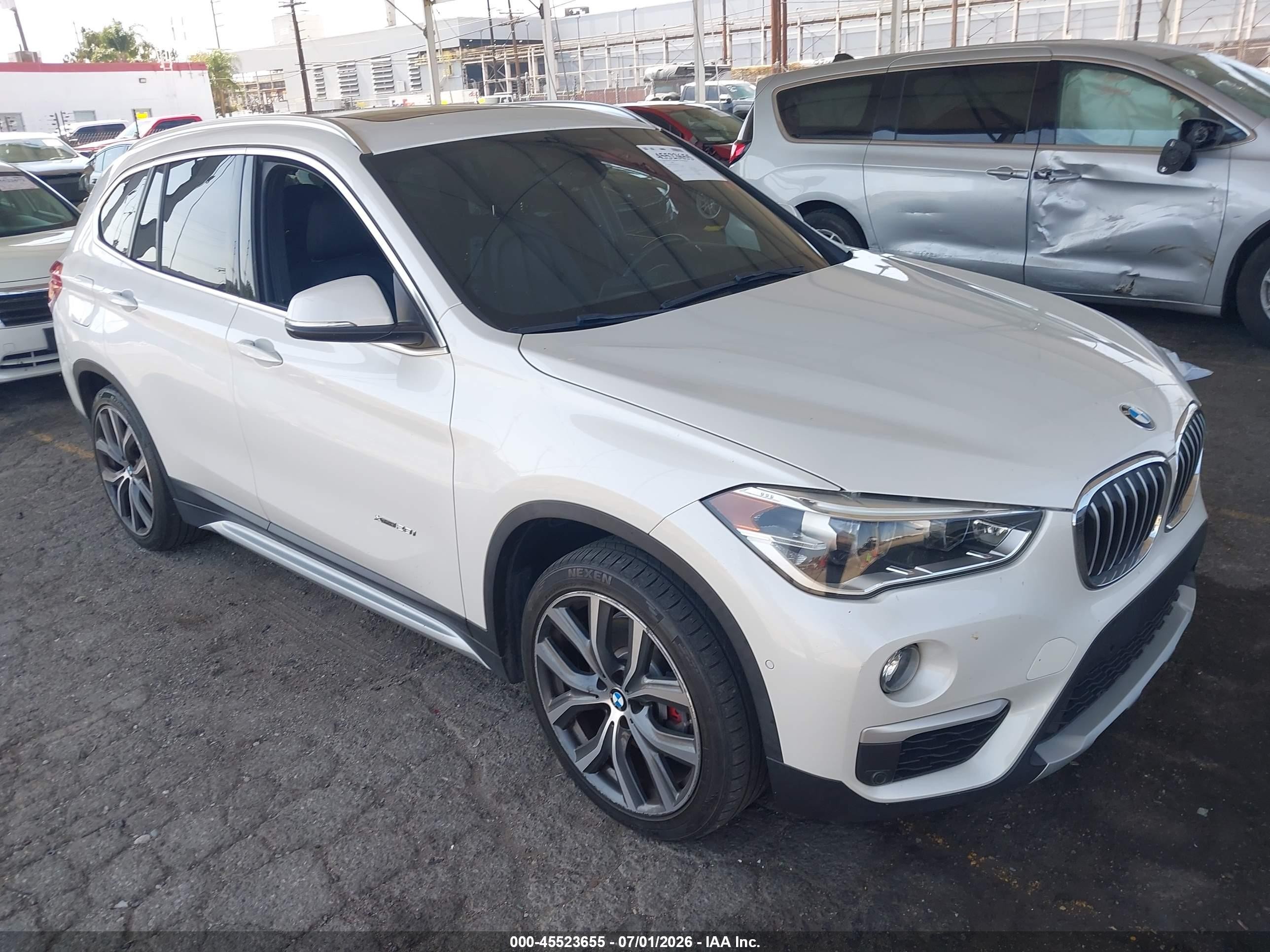 2016 BMW X1 xDrive28i, VIN WBXHT3C39G5E47320 — Side
