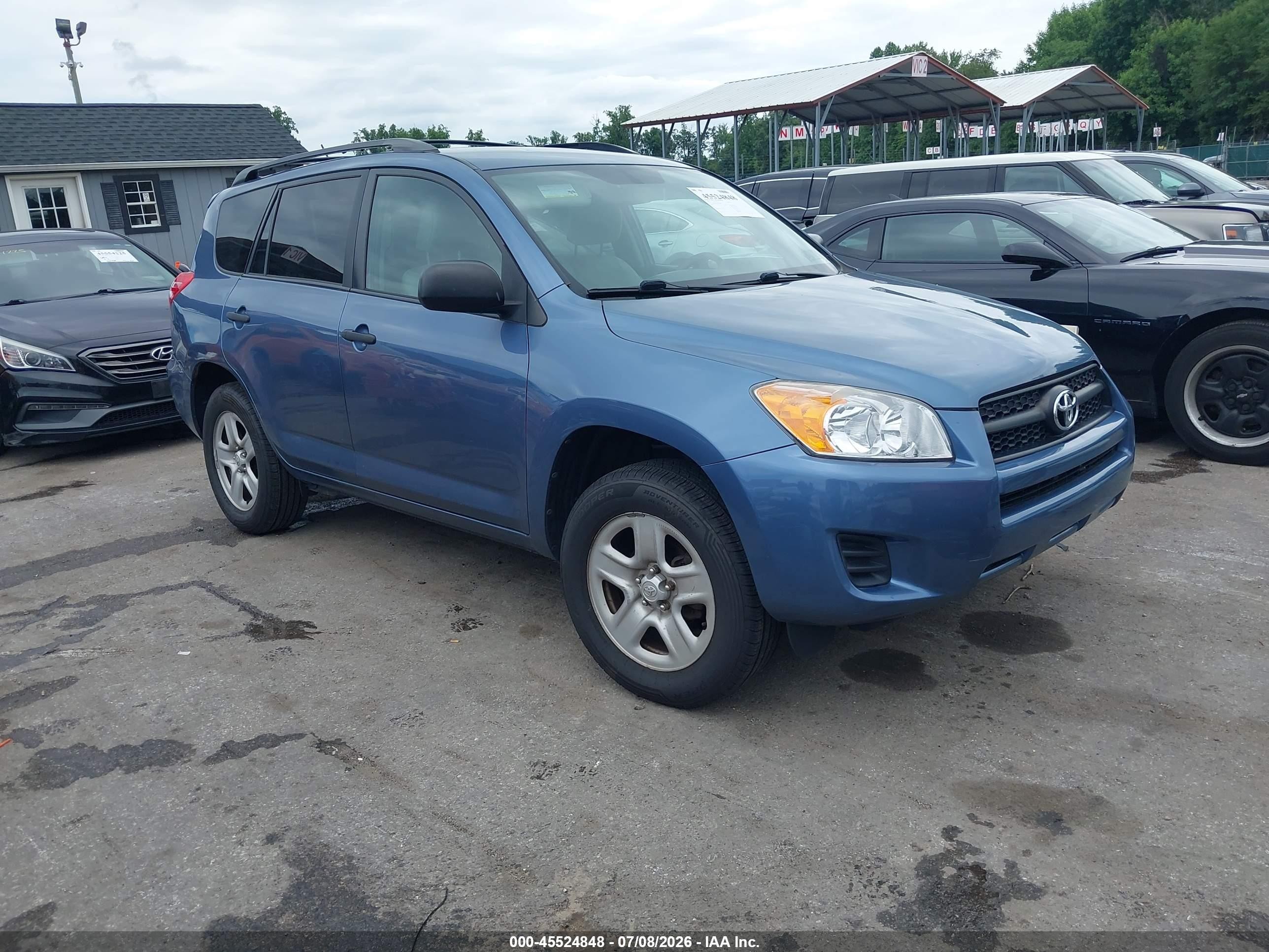 2011 Toyota RAV4, VIN 2T3BF4DVXBW128474 — Side