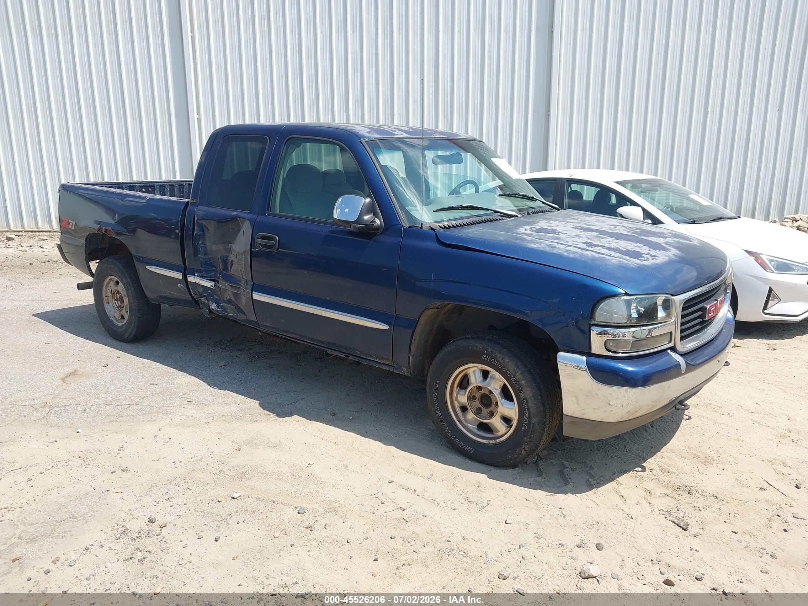 1999 GMC Sierra 1500 Work Truck, VIN 1GTEK19V2XE518077 — Normal wear