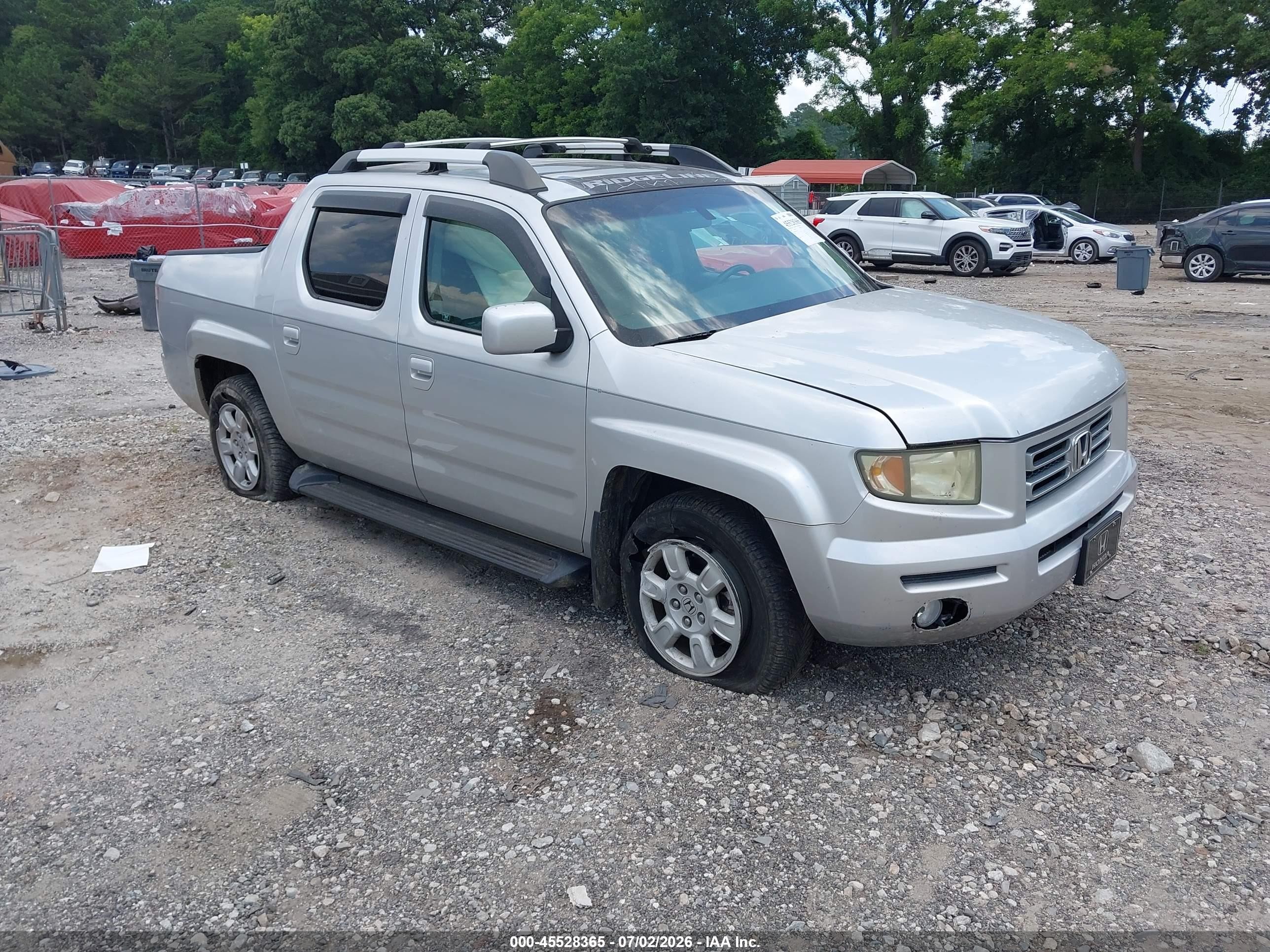 2007 Honda Ridgeline RTL, VIN 2HJYK16547H521584 — Side
