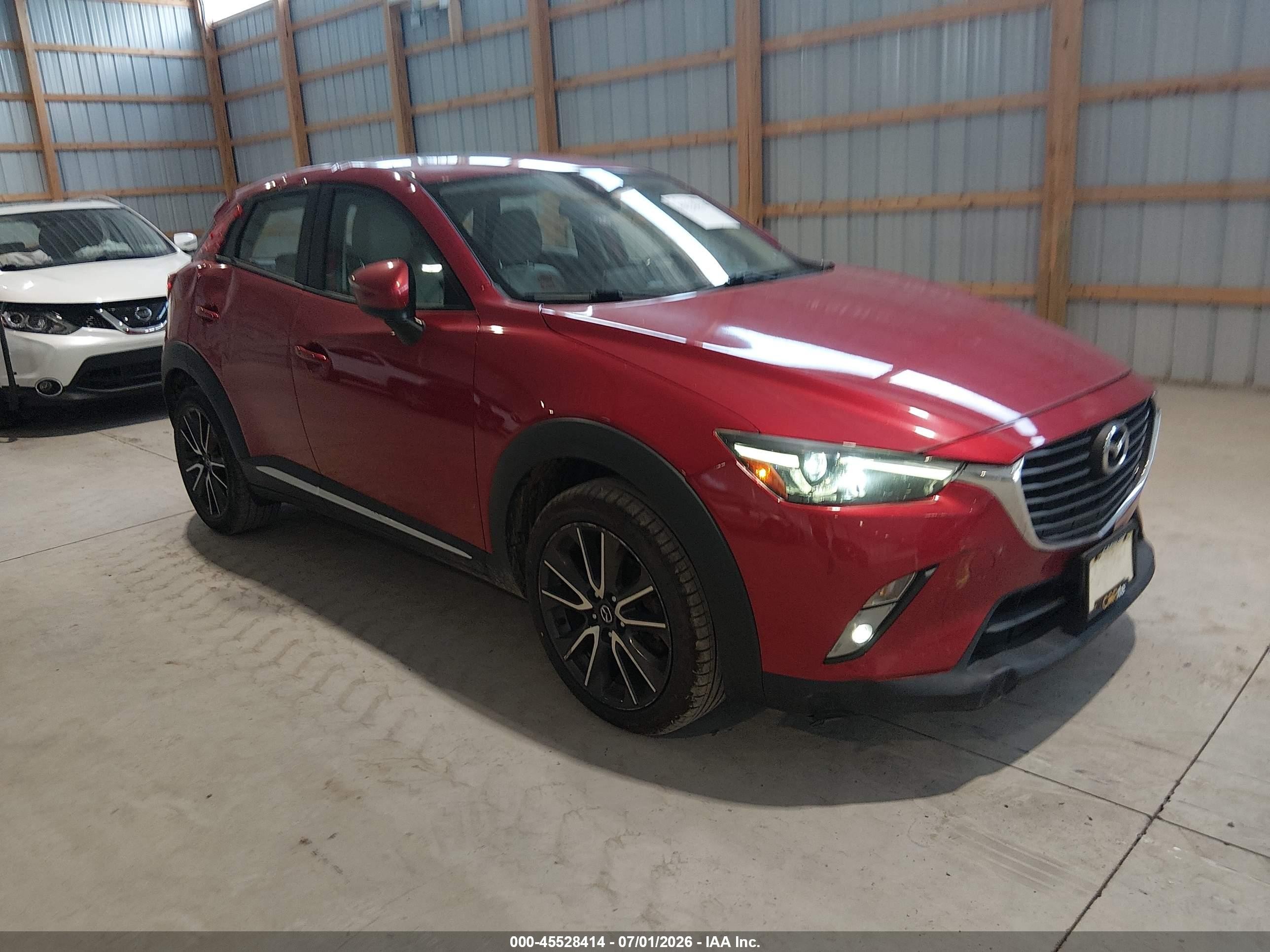 2016 Mazda CX-3 Grand Touring, VIN JM1DKBD75G0114035 — Side