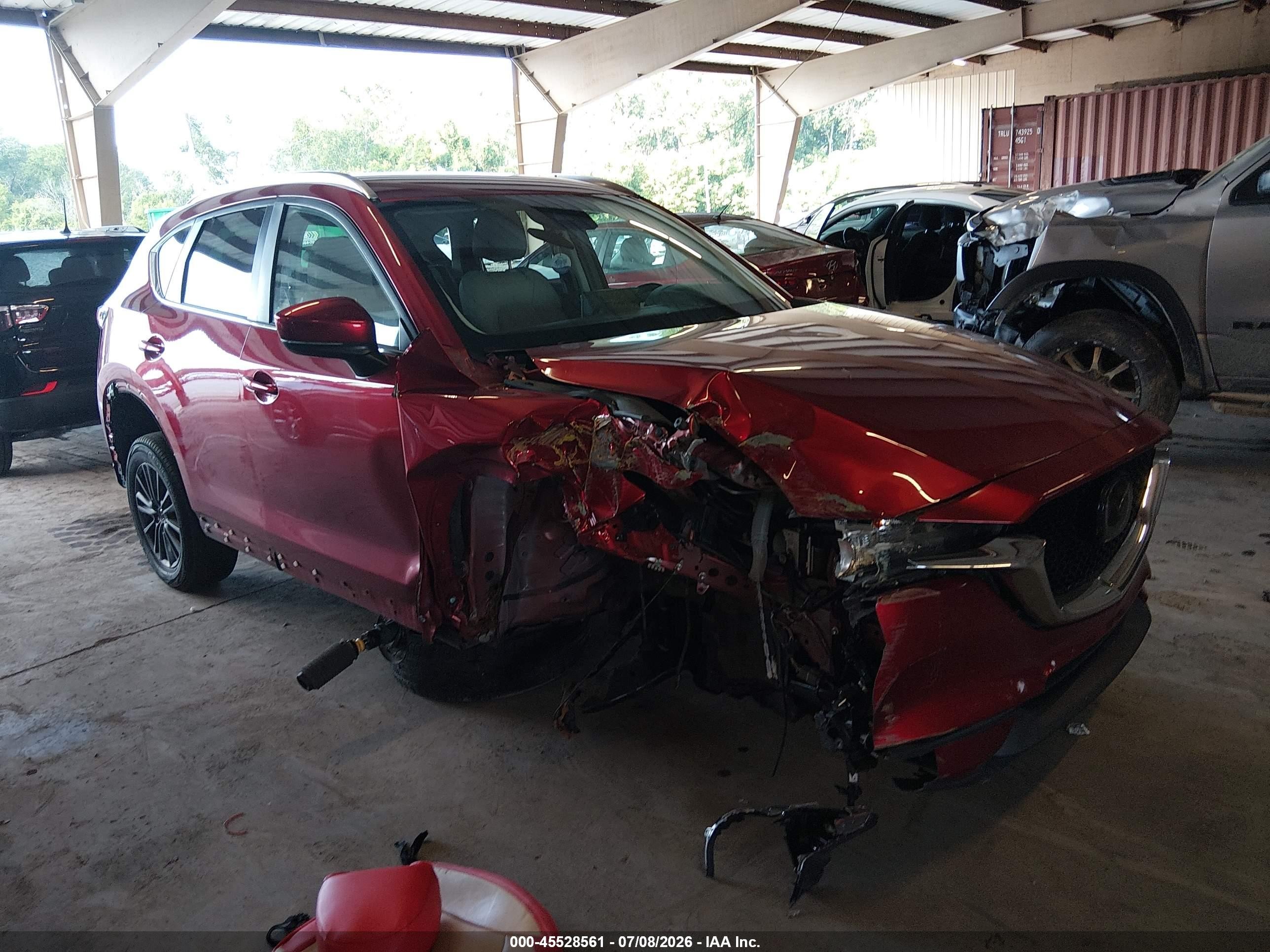 2021 Mazda CX-5 Touring, VIN JM3KFACM5M1377894 — Front end