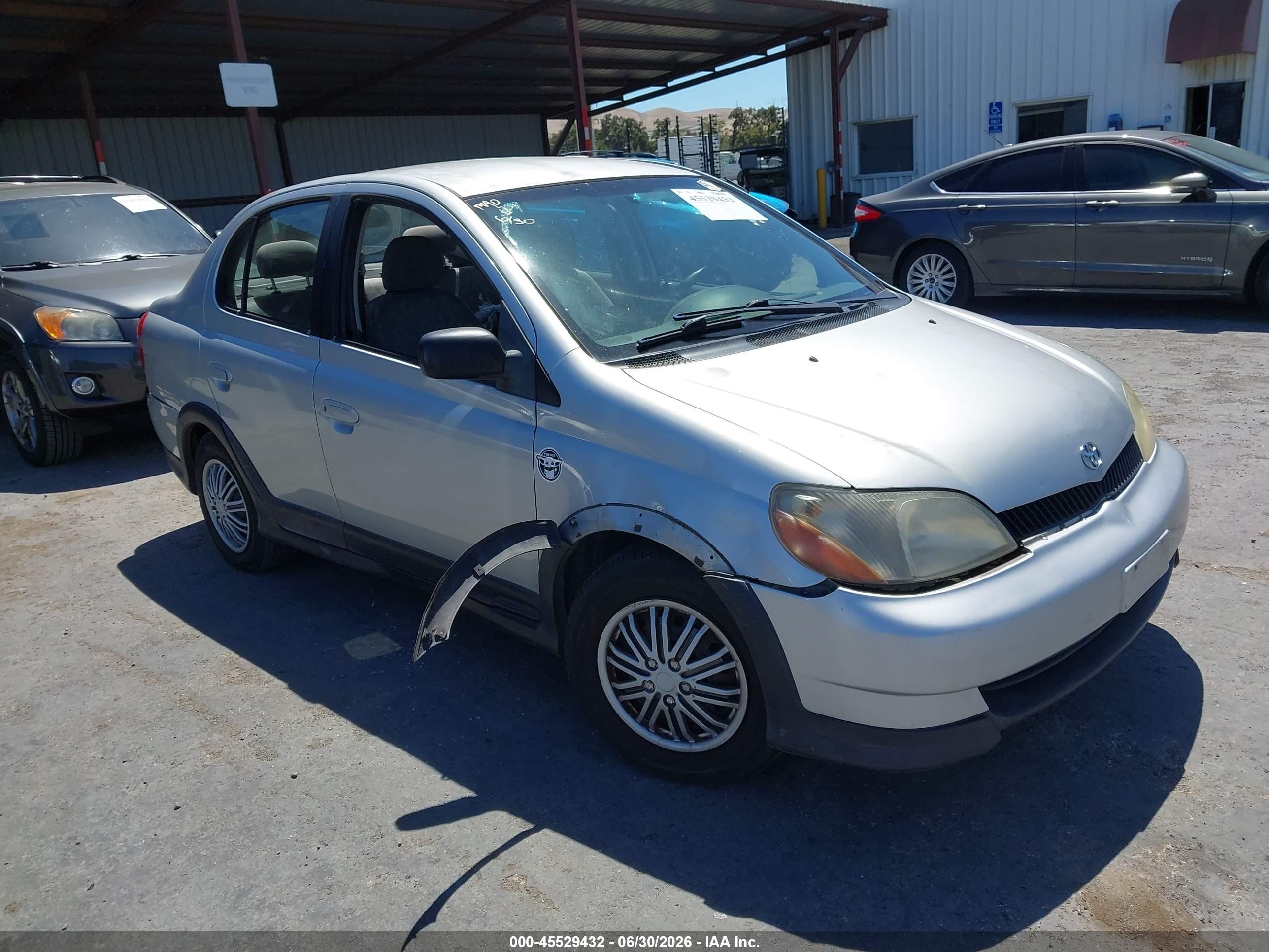 2001 Toyota ECHO, VIN JTDBT123110146535 — Бок
