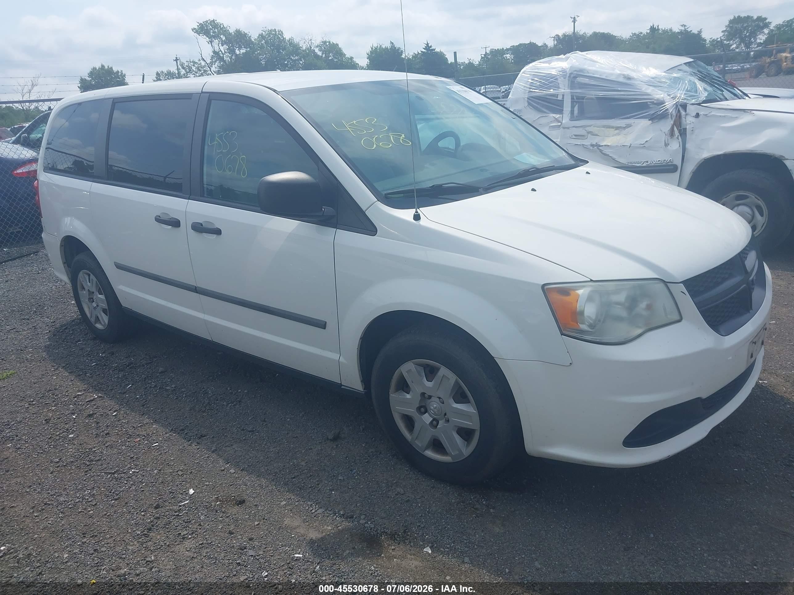 2012 Ram Cargo Van, VIN 2C4RDGAG4CR225435 — Side