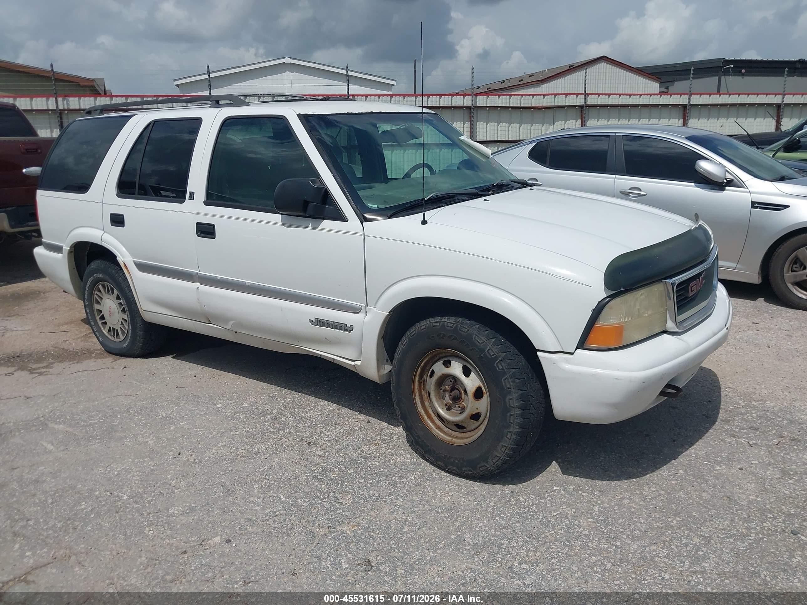 1999 GMC Jimmy SLT, VIN 1GKDT13WXX2519428 — Normal wear