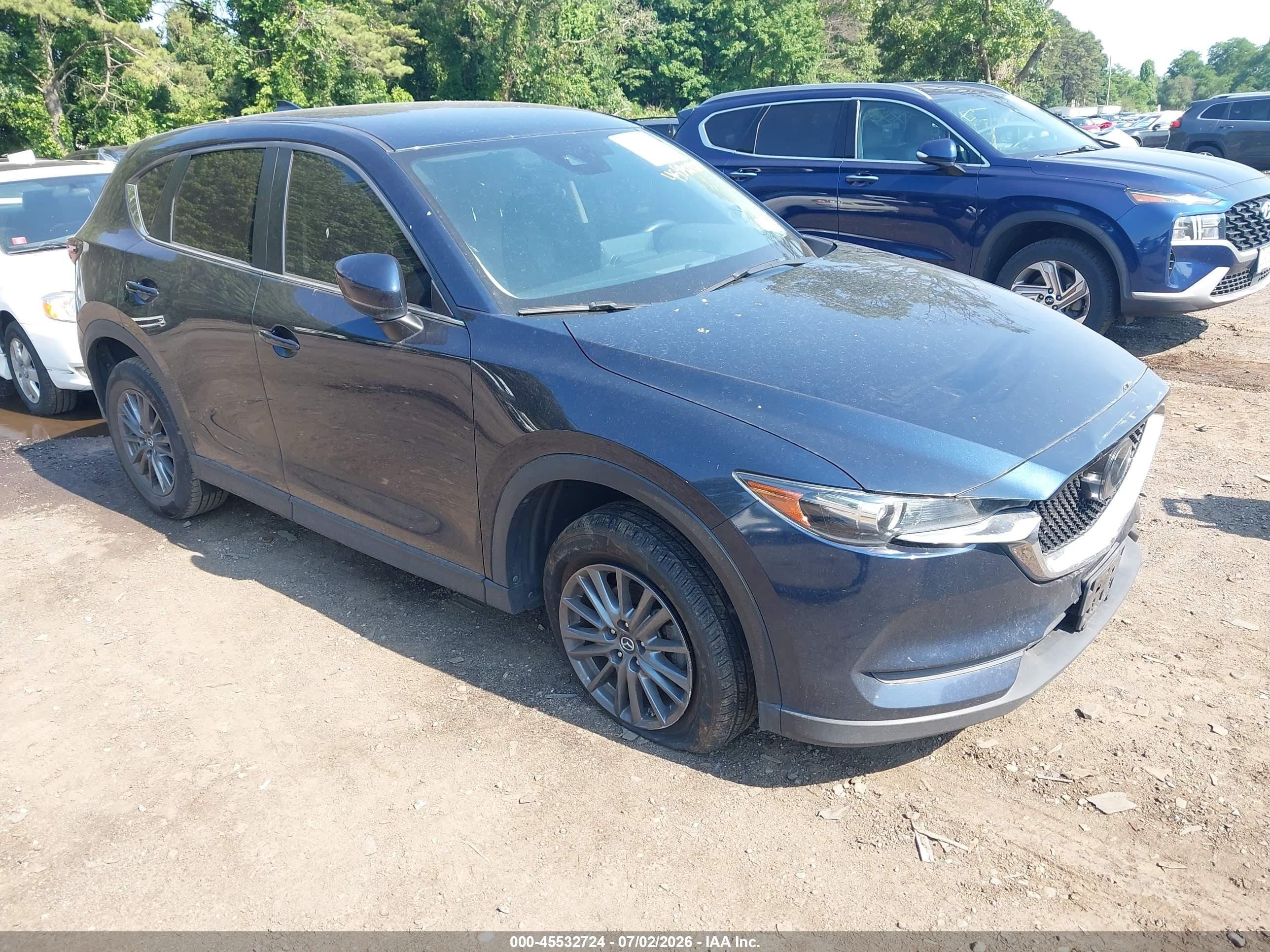 2021 Mazda CX-5 Touring, VIN JM3KFBCM1M0413737 — Rear end
