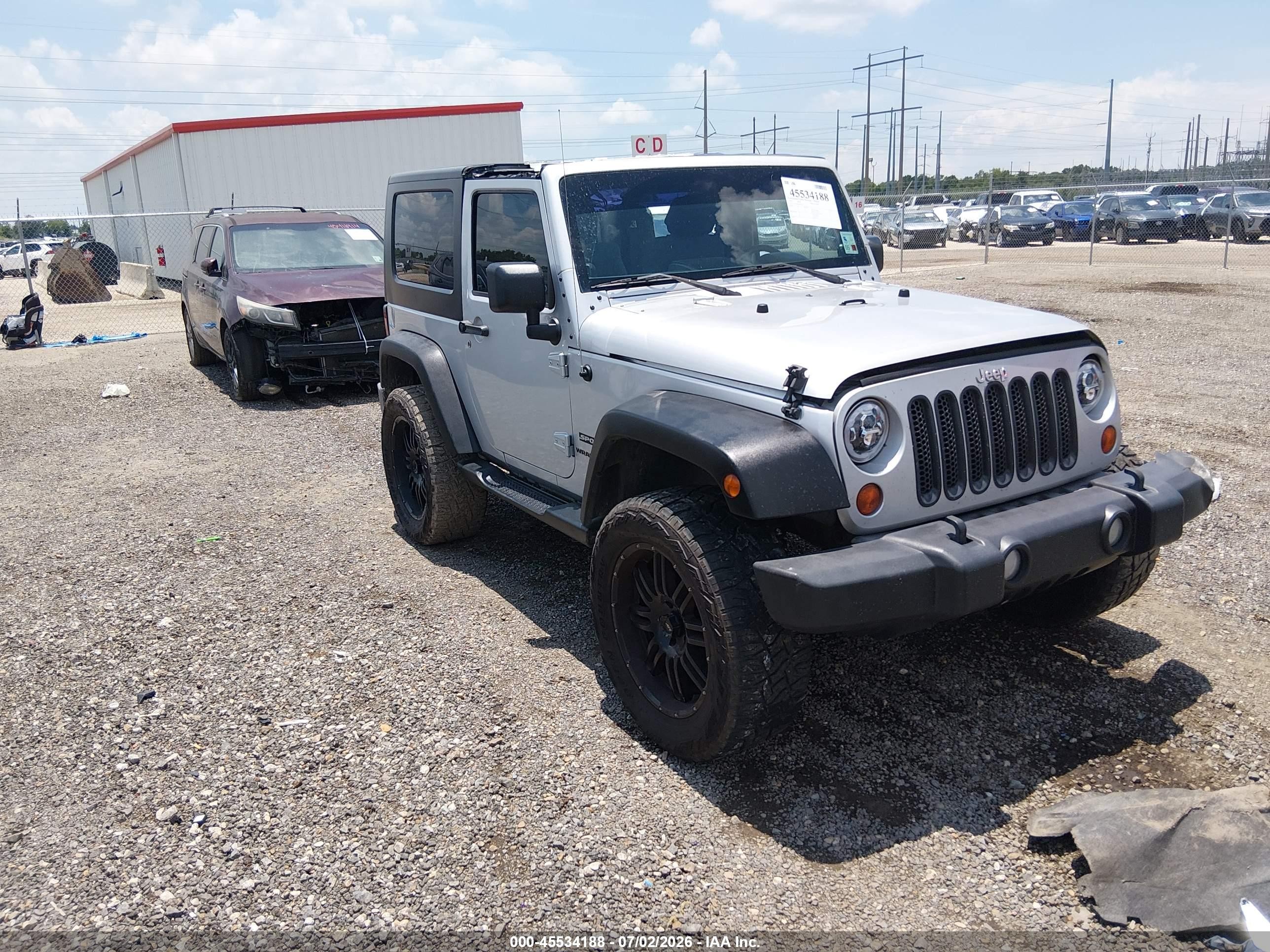 2010 Jeep Wrangler Islander, VIN 1J4AA2D11AL183032 — Side