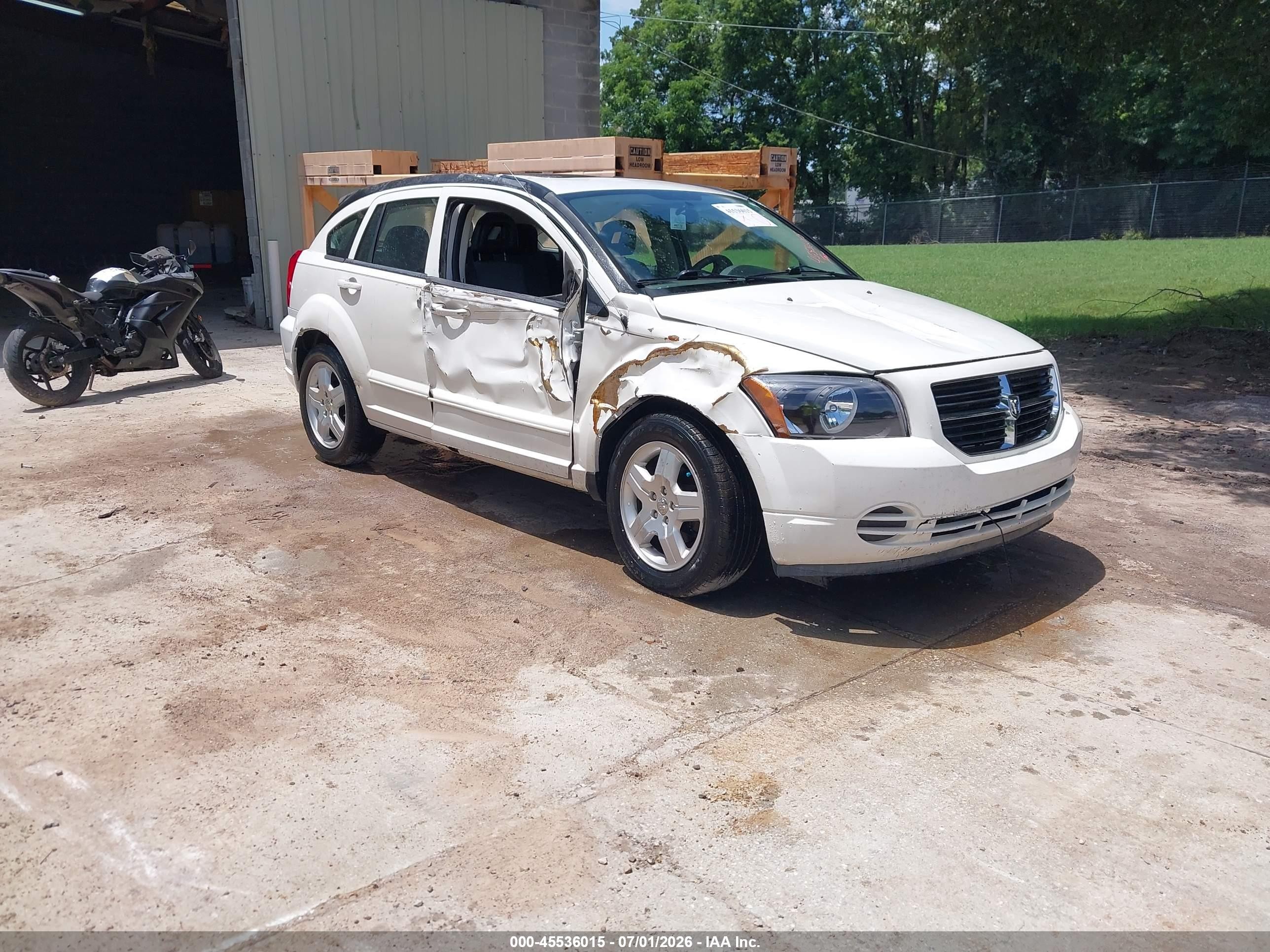 2009 Dodge Caliber SXT, VIN 1B3HB48AX9D235630 — Бок