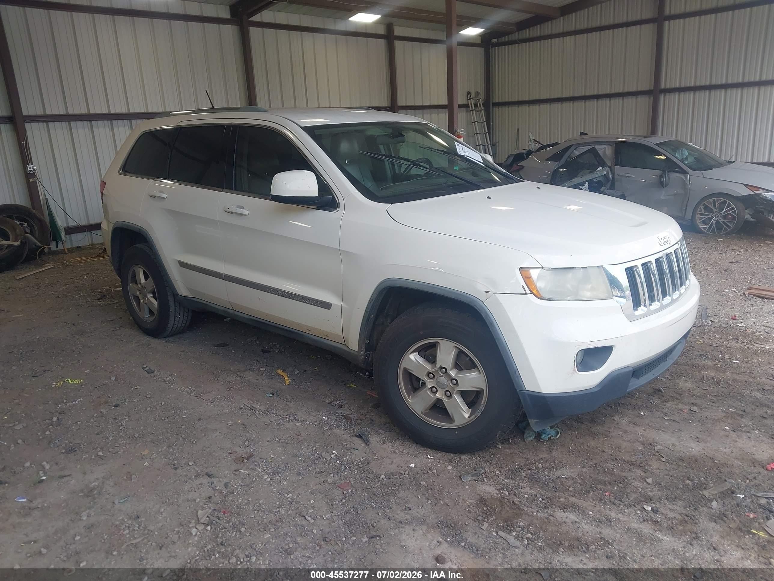 2012 Jeep Grand Cherokee Laredo, VIN 1C4RJEAG3CC177416 — Side