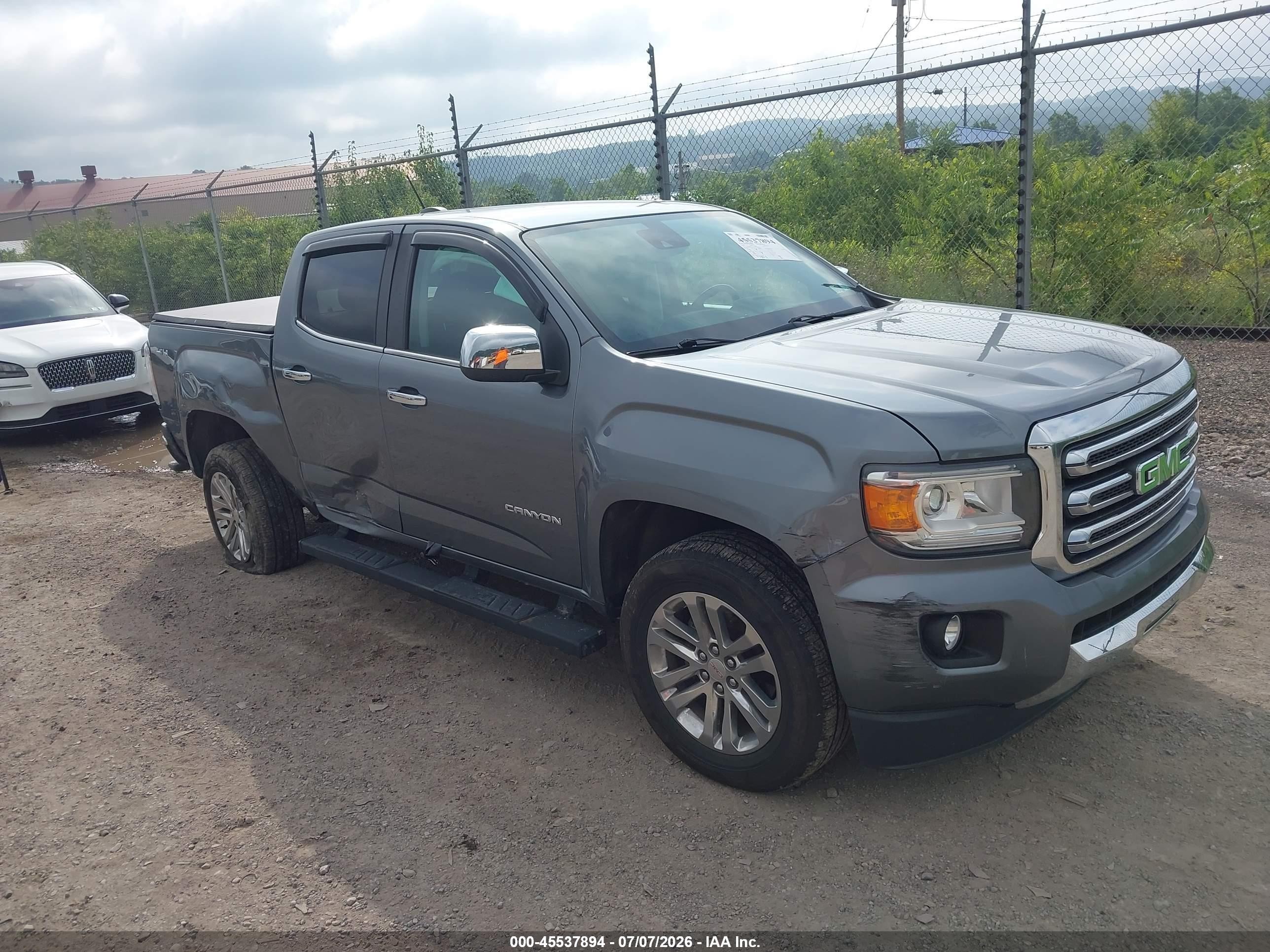2020 GMC Canyon 4WD SLT, VIN 1GTG6DEN6L1231069 — Side