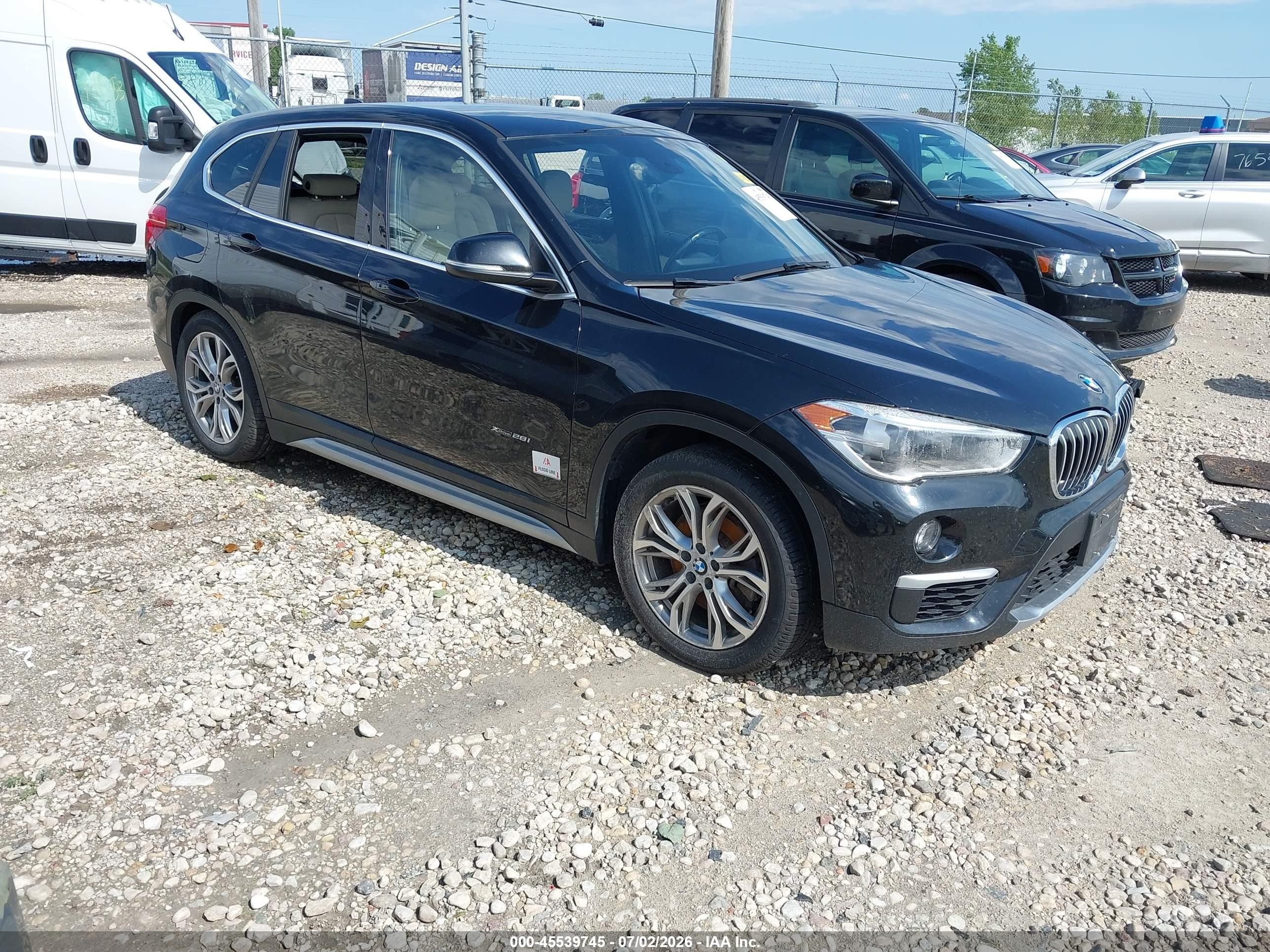2018 BMW X1 xDrive28i, VIN WBXHT3C39J5F88198 — Fresh water flood