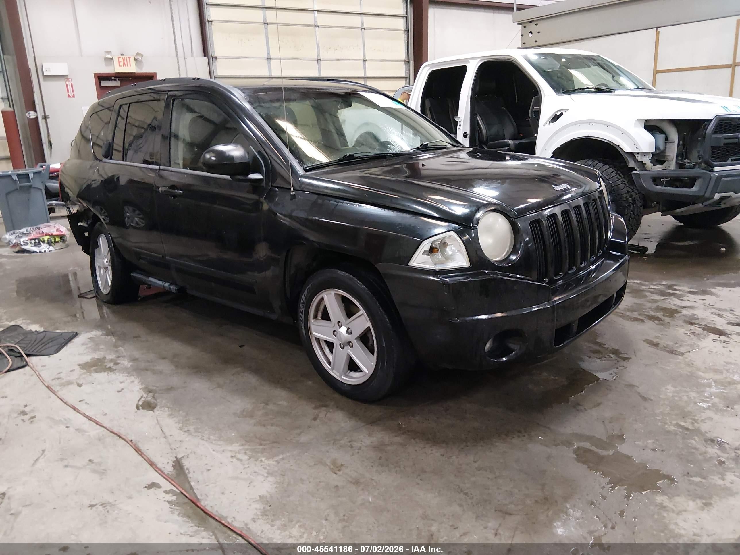 2010 Jeep Compass Sport, VIN 1J4NT4FB6AD578699 — Rear end