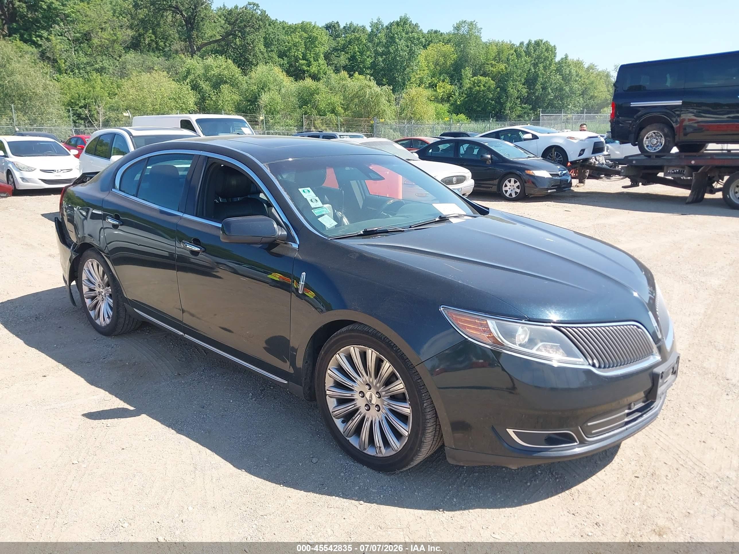 2014 Lincoln MKS, VIN 1LNHL9EK7EG603871 — Rear end