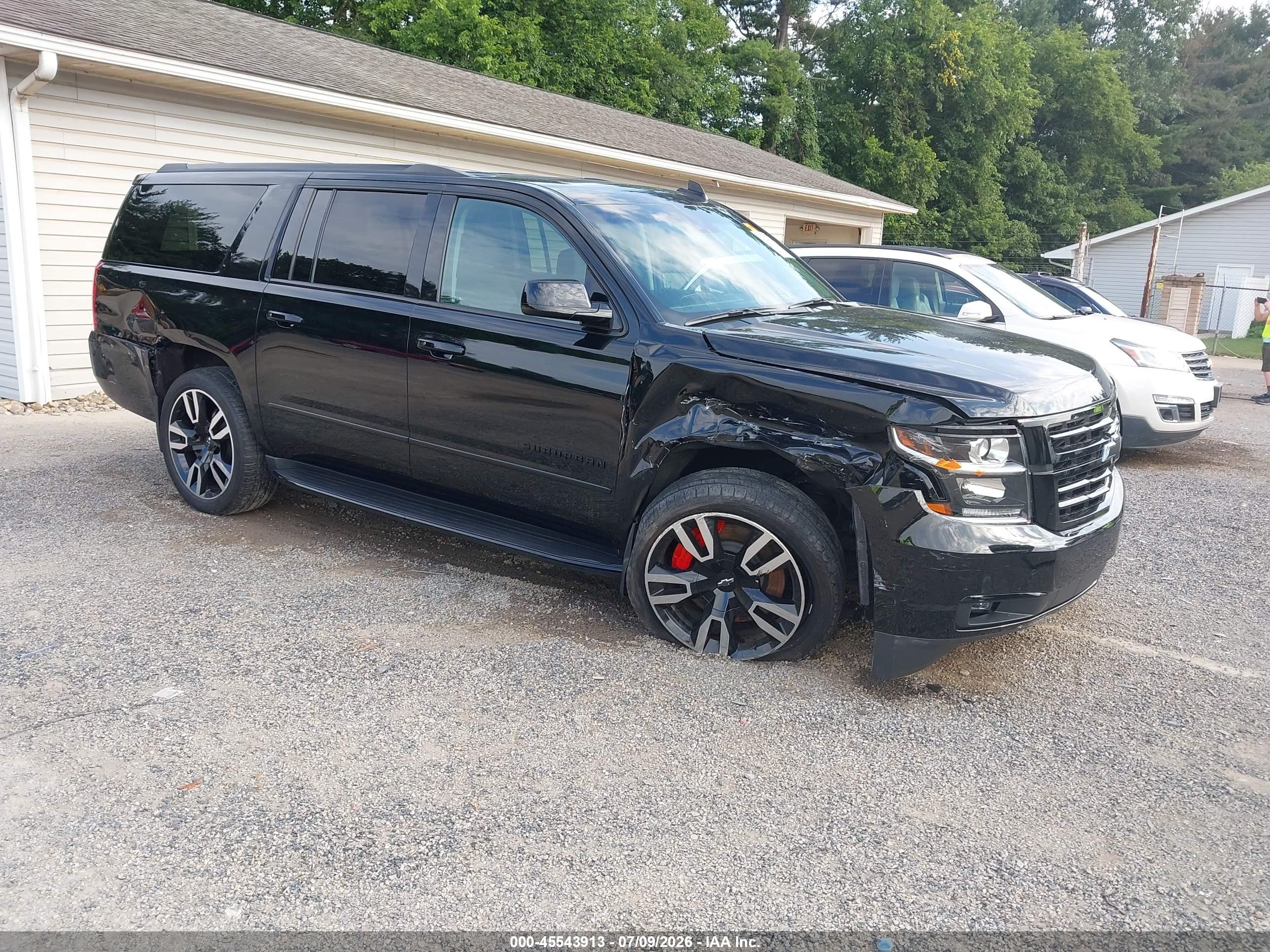 2019 Chevrolet Suburban Premier, VIN 1GNSKJKJ6KR127775 — Side