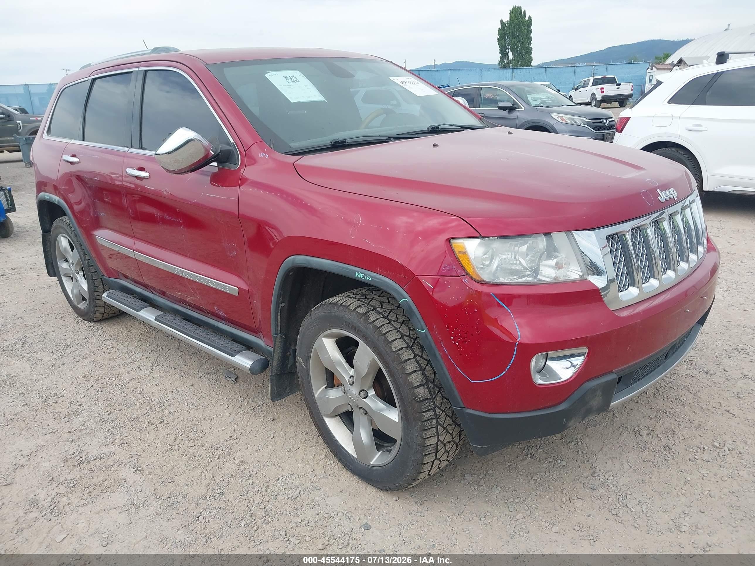 2011 Jeep Grand Cherokee Overland, VIN 1J4RR6GG0BC586326 — Side