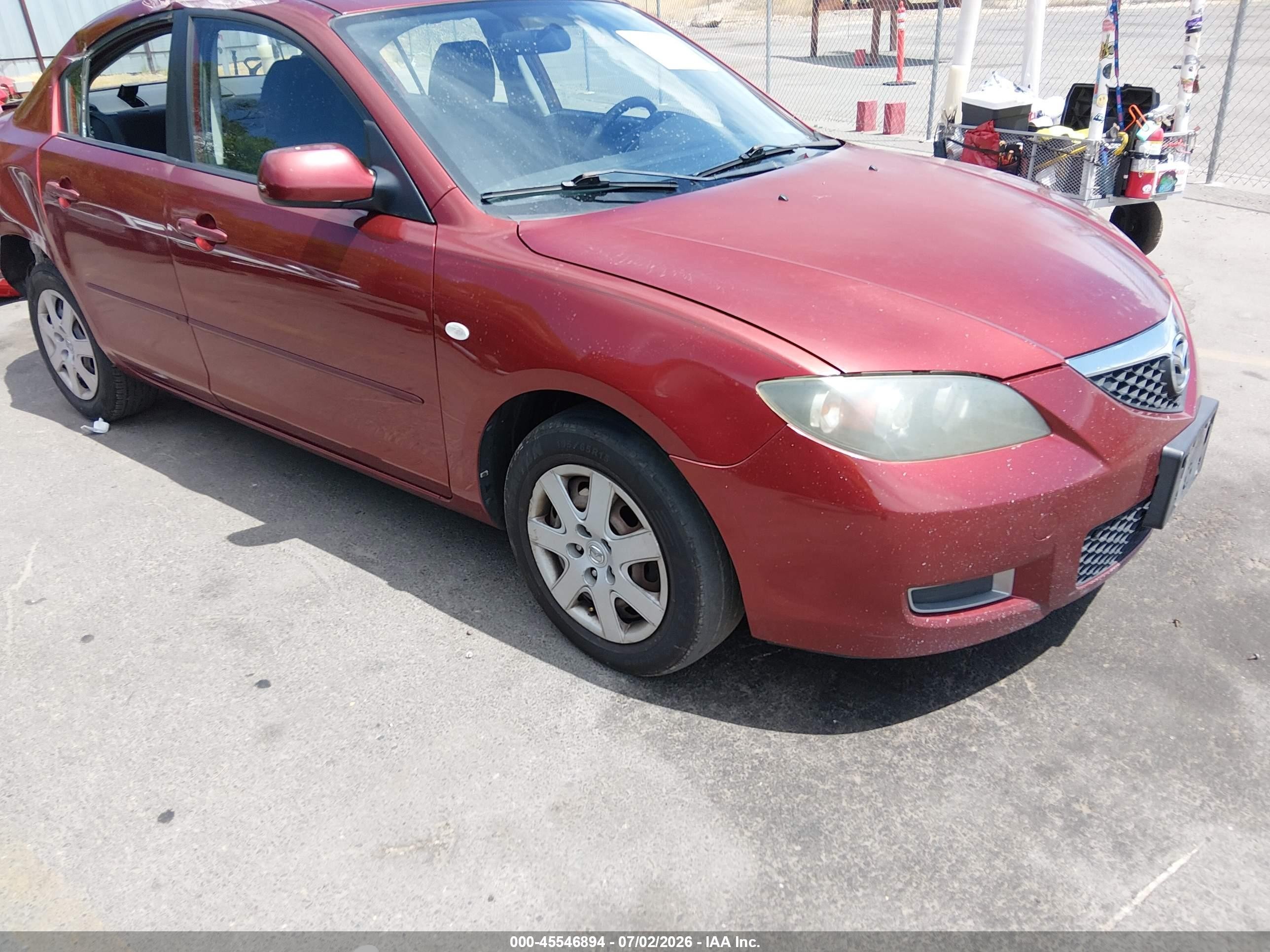 2009 Mazda 3 i Sport, VIN JM1BK32F991216989 — Side