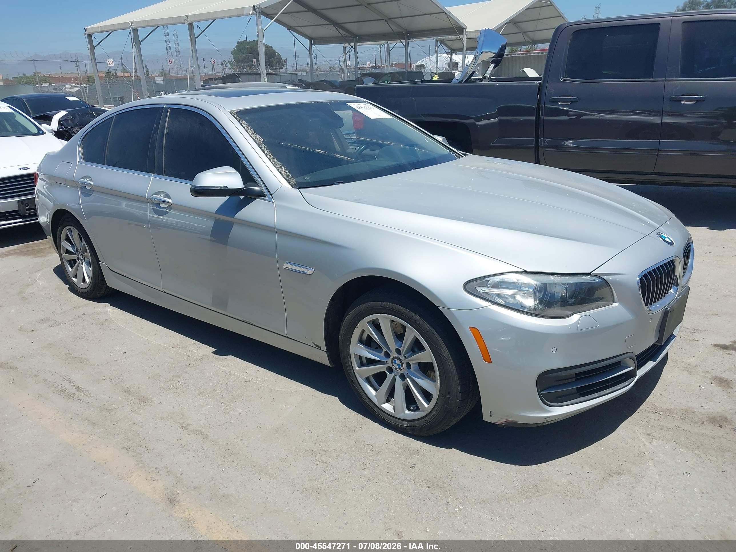 2014 BMW 5 Series 528i xDrive, VIN WBA5A7C52ED219591 — Side