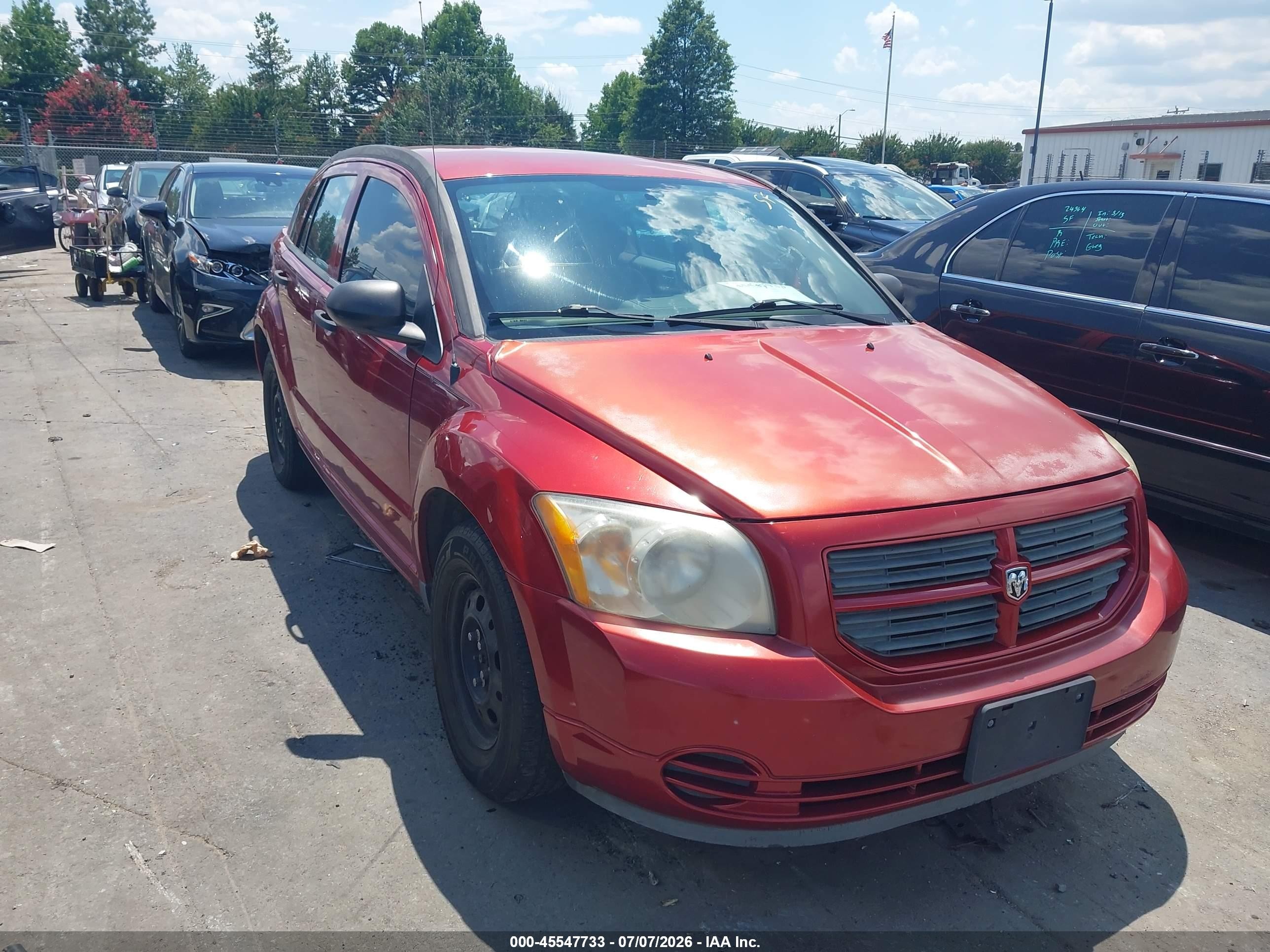 2011 Dodge Caliber, VIN 1B3CB1HA7BD111202 — Side