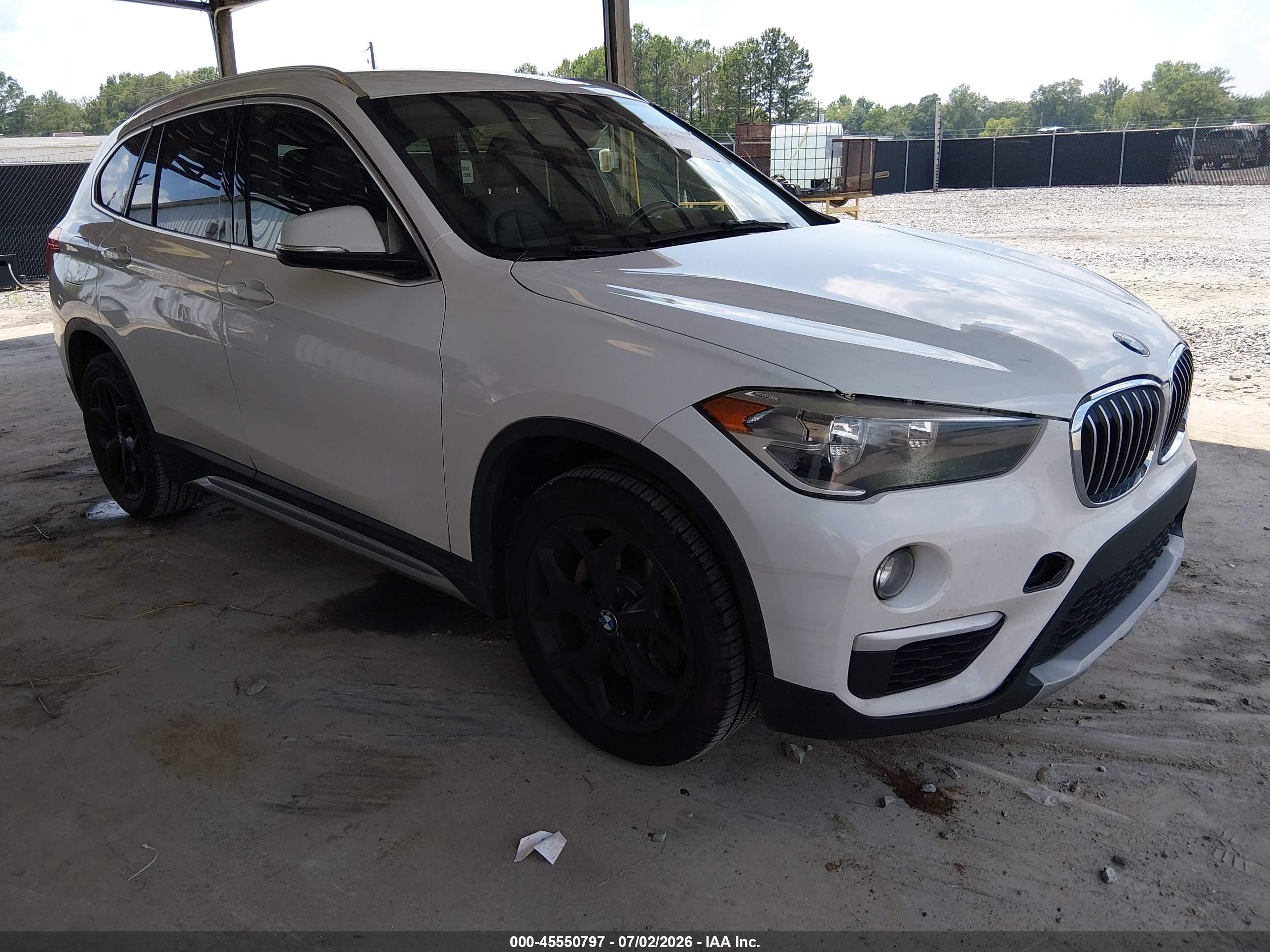 2018 BMW X1 sDrive28i, VIN WBXHU7C3XJ3F04566 — Undercarriage